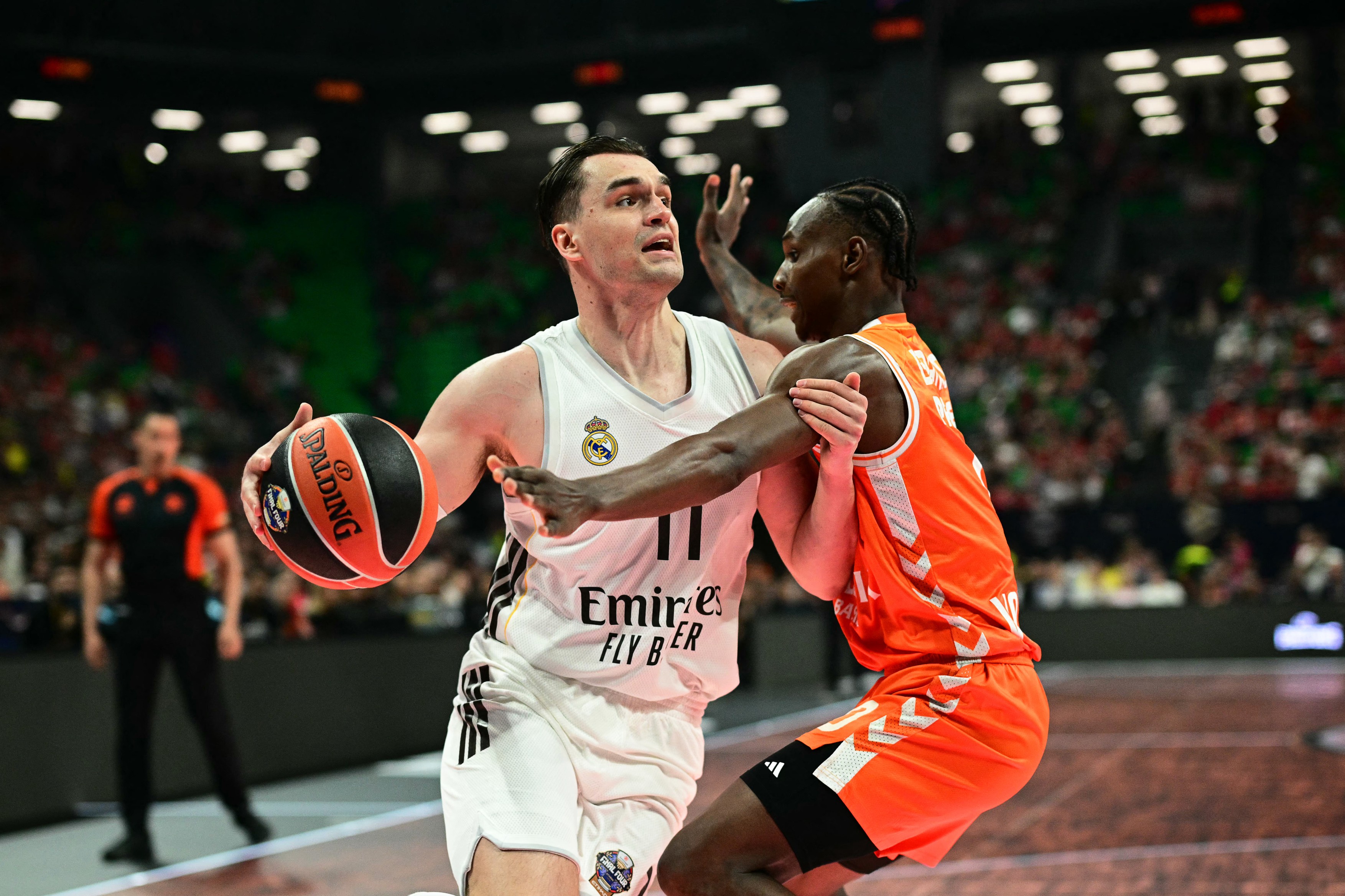 Real Madrid's Croatian forward #11 Mario Hezonja (L)