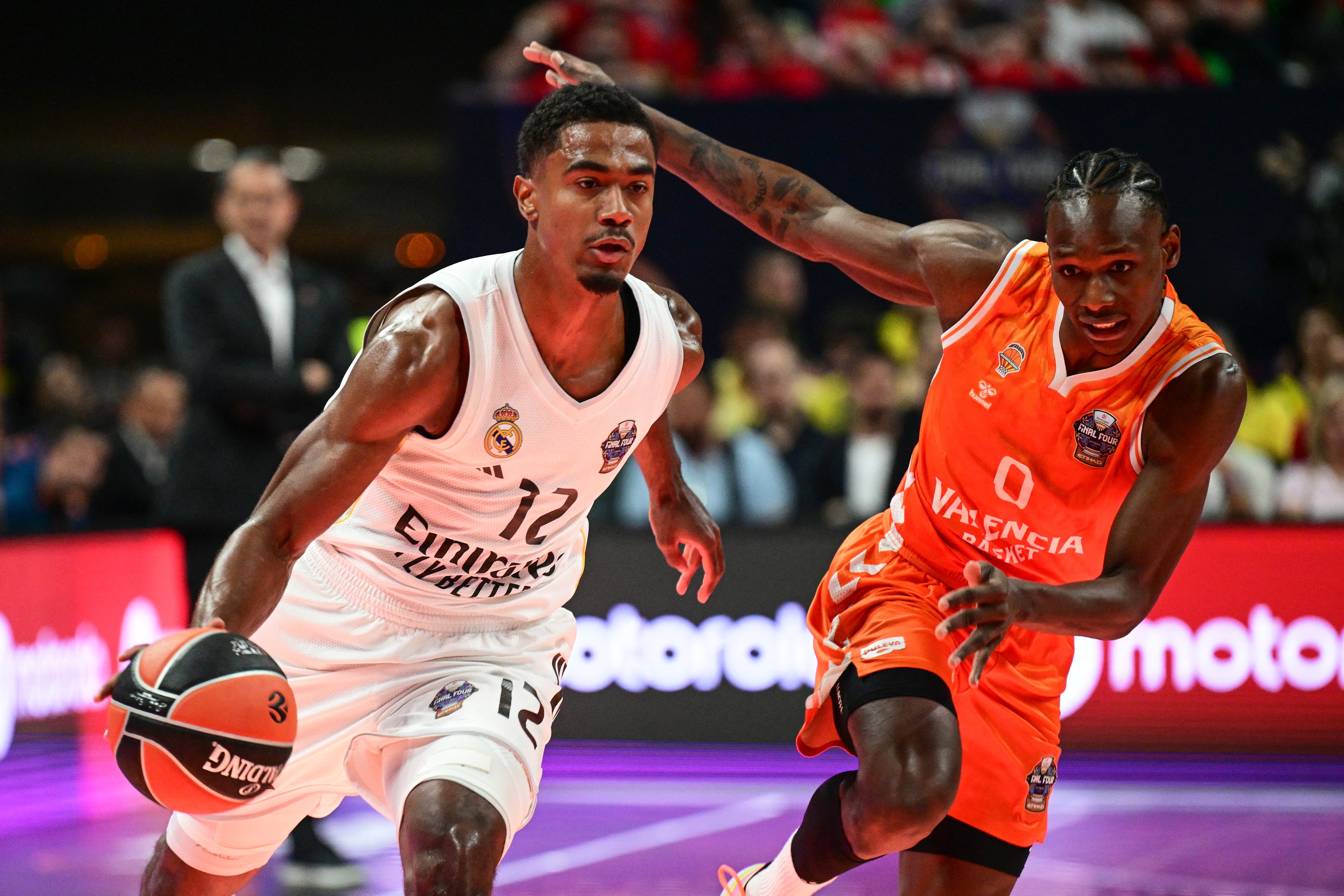 Real Madrid's French guard #12 Theo Maledon (L)