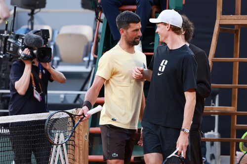 Novak Djokovic of Serbia and Jannik Sinner of Italy during the special e