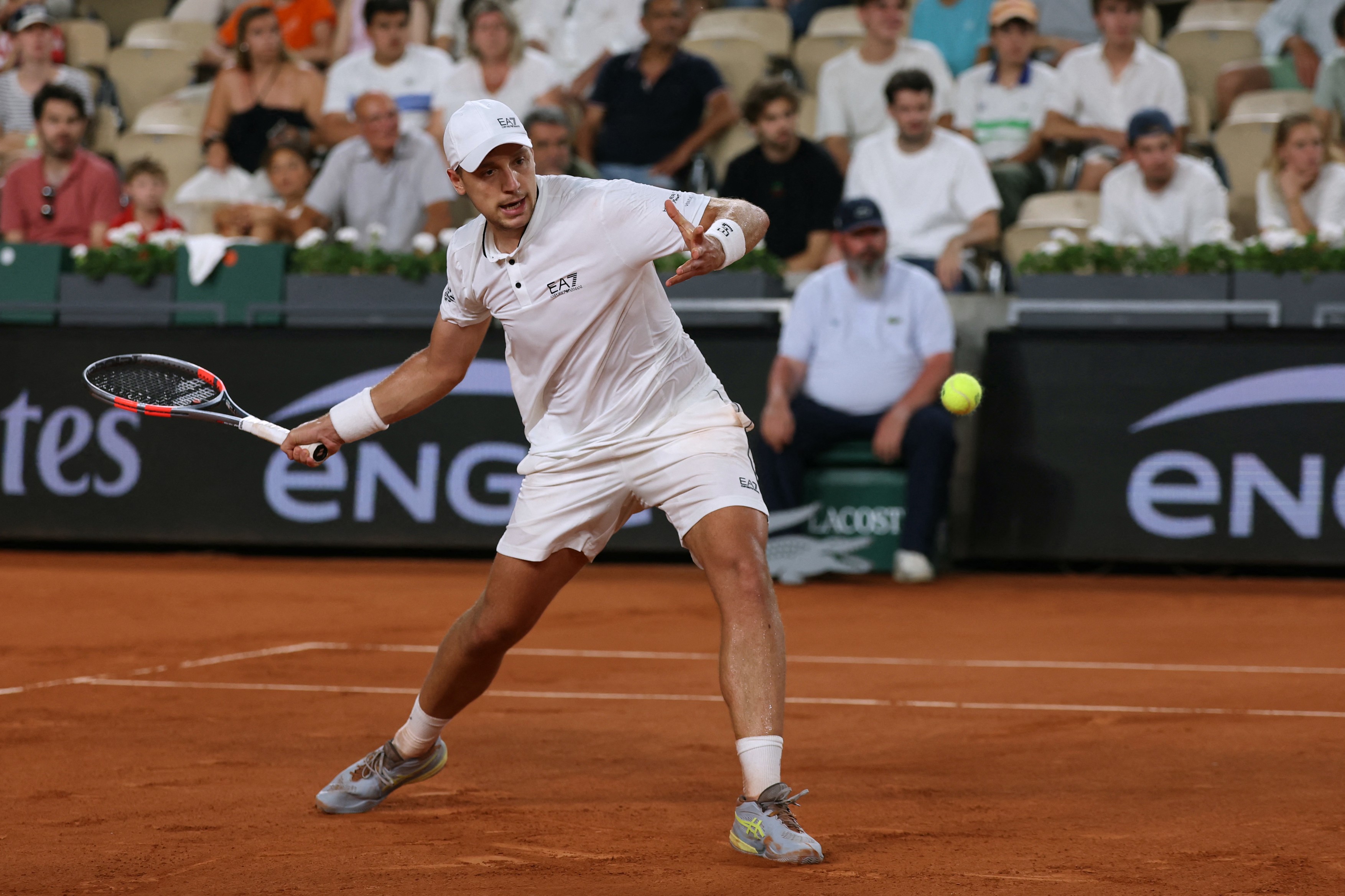 Serbia's Hamad Medjedovic plays a forehand return to Norway's Casper Ruud during their men's singles match on day 4 of the French Open tennis tournament on Court Suzanne-Lenglen at the Roland-Garros Complex in Paris on May 27, 2026.