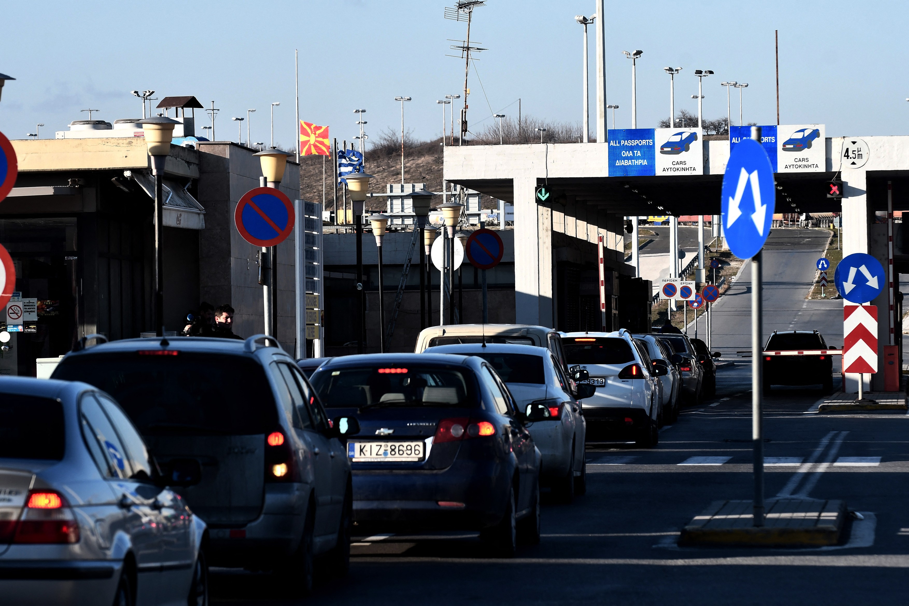 Cars wait at the customs station in Evzoni, at the border of Greece and North Macedonia