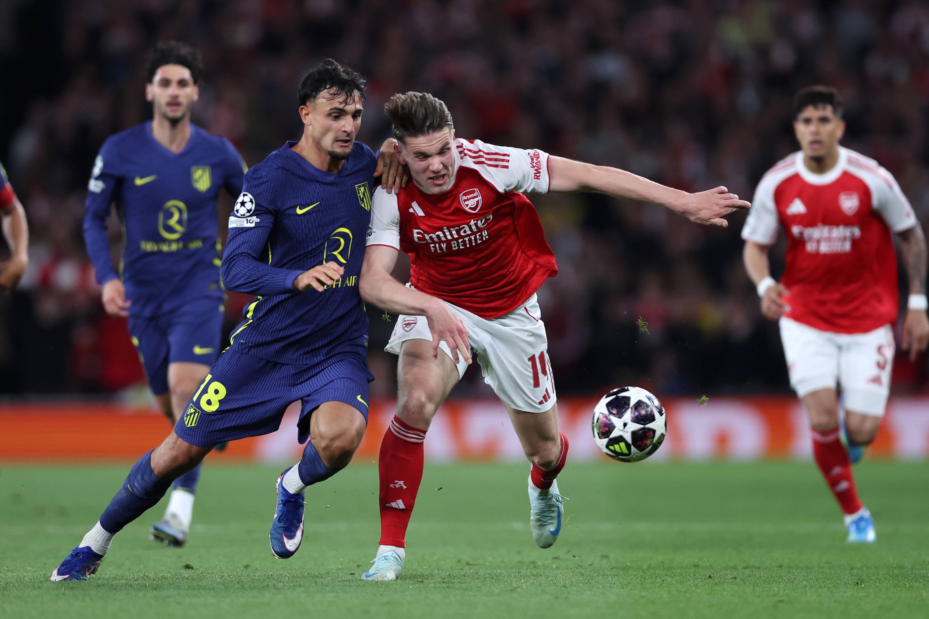Marc Pubill of Atletico Madrid and Viktor Gyokeres of Arsenal challenge for the ball