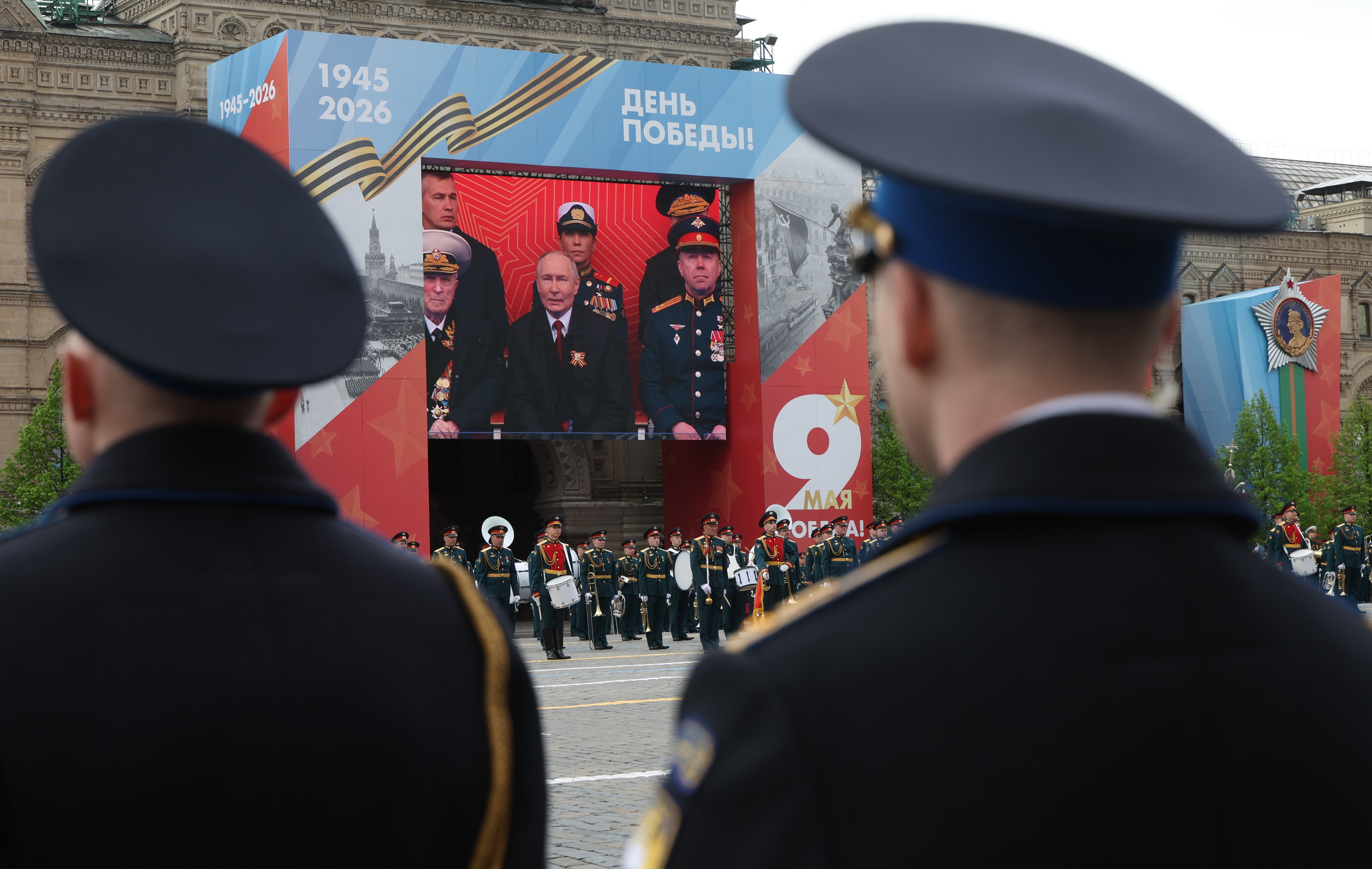 epa12942871 A screen display shows Russian President Vladimir Putin