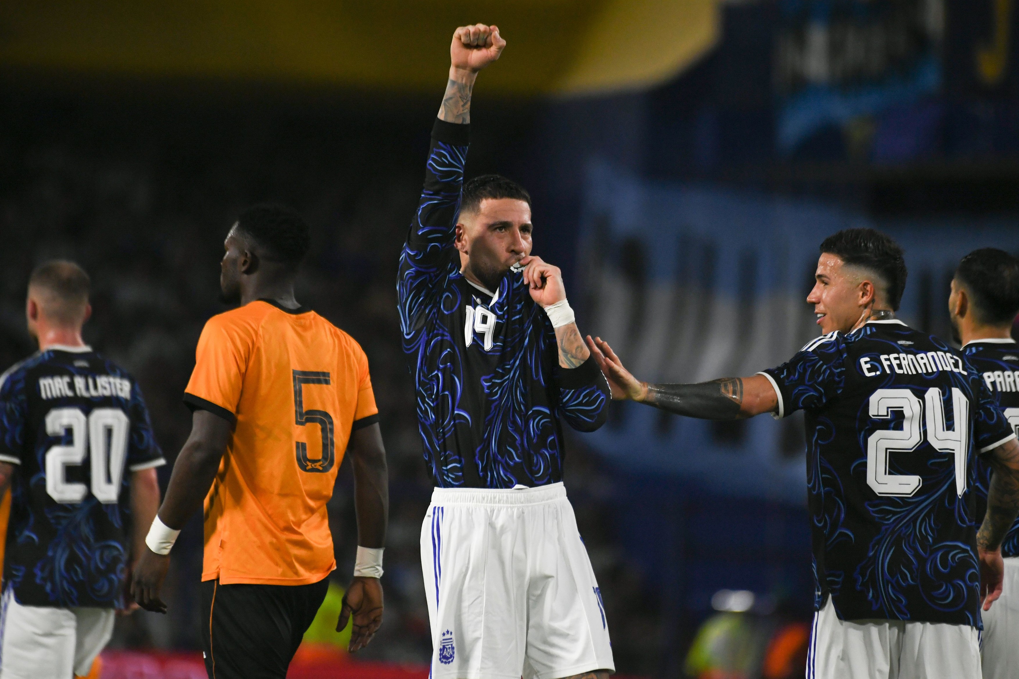 Nicolas Otamendi celebrates the third goal from a penalty against Zambia at La Bombonera stadium in Buenos Aires, Argentina.