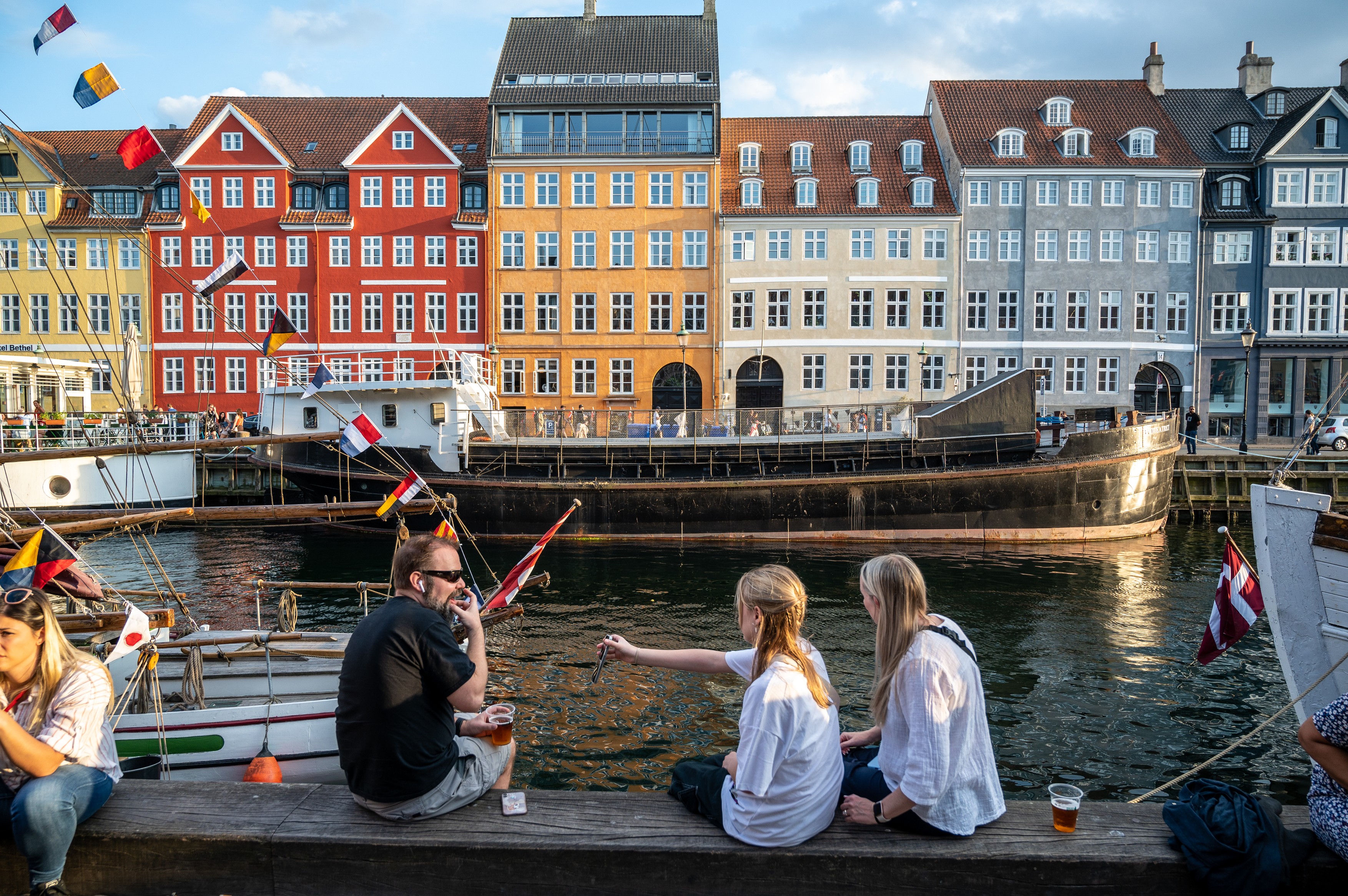 Colorfull facade and old ships along the Nyhavn Canal in Copenhagen Denmark