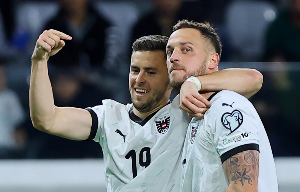 epa12528317 Marko Arnautovic (R) of Austria celebrates