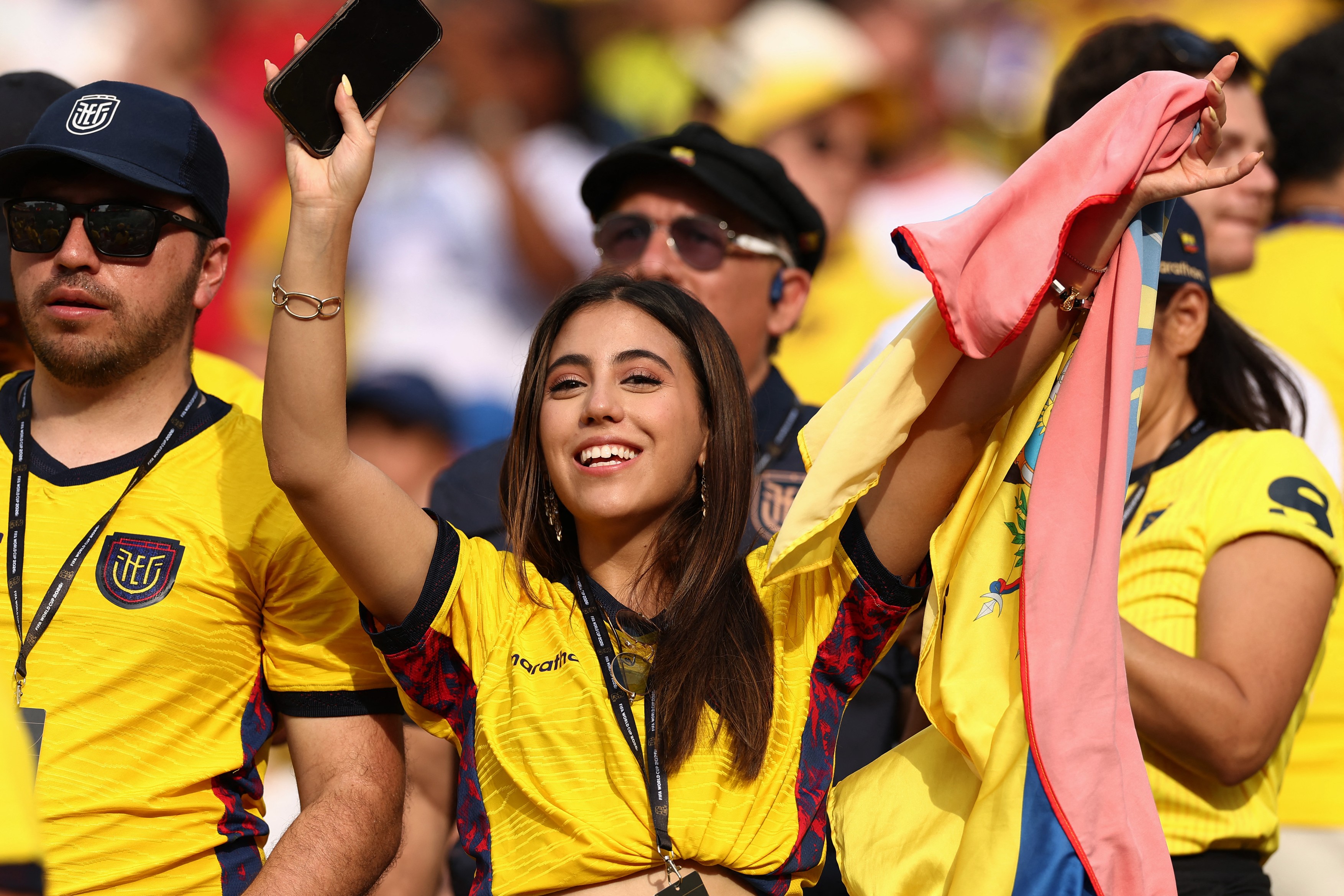An Ecuadorian fan cheers for her team ahead of the 2026 World Cup Group E