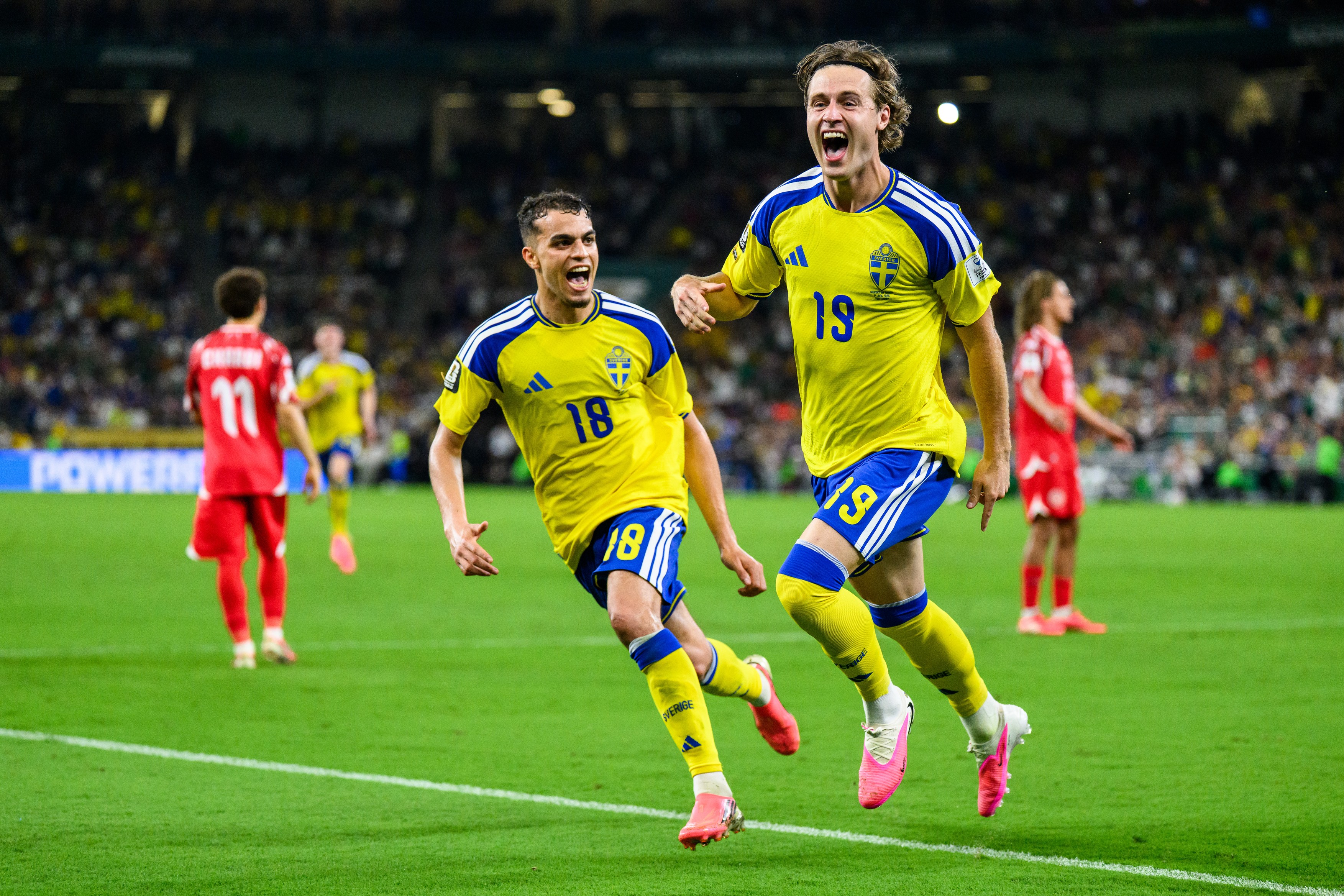 260614 Yasin Ayari of Sweden and Mattias Svanberg of Sweden celebrate