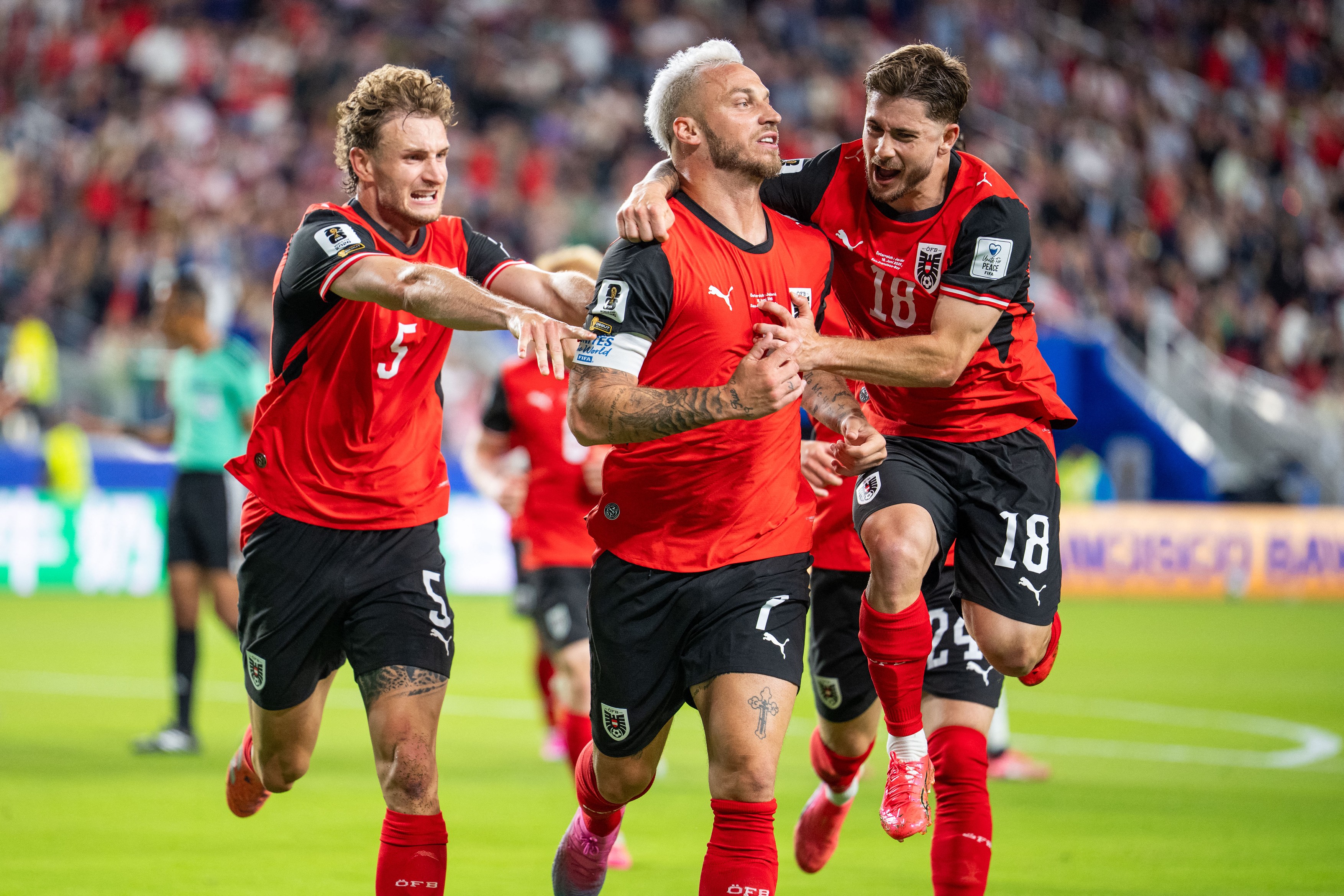 Austria's forward #07 Marko Arnautovic (C) celebrates with Austria's defž