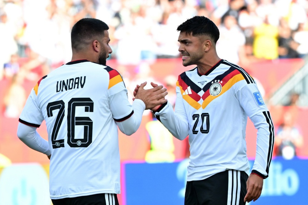 epa13052743 Deniz Undav of Germany (L) celebrates