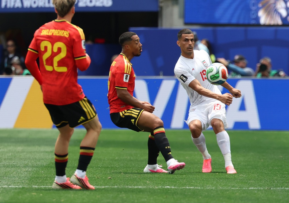 epa13054904 Youri Tielemans of Belgium (L) and Ali Nemati of Iran in action