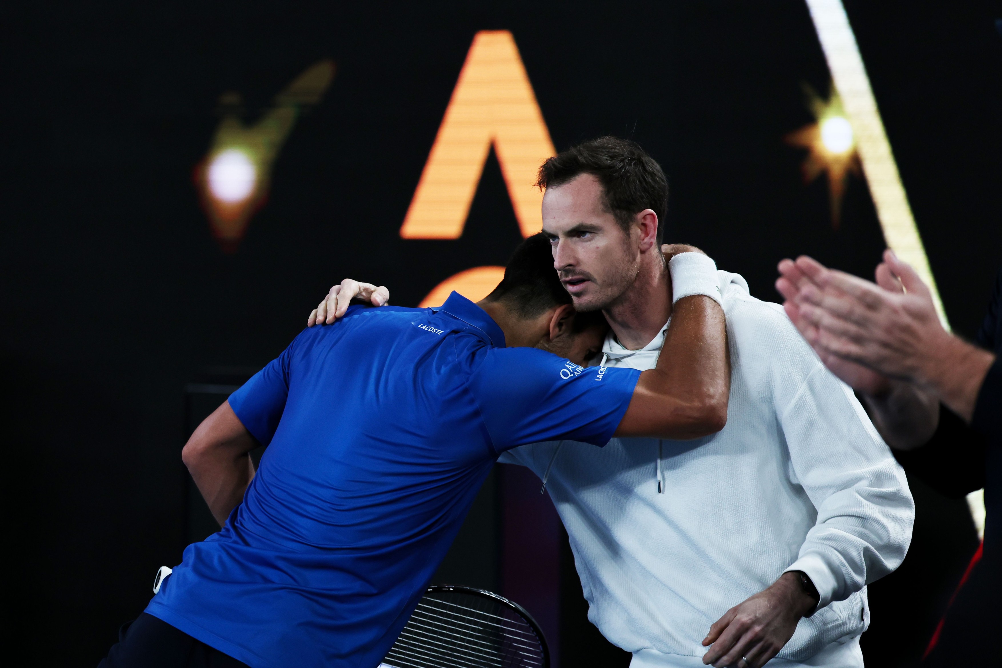 Novak Djokovic celebrates with Andy Murray after winning his Quarter-final
