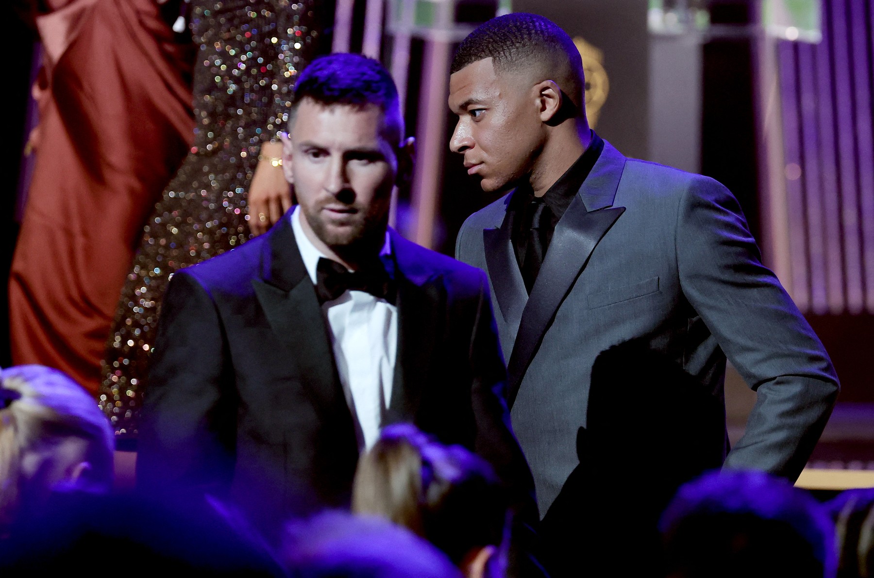 Inter Miami CF's Argentine forward Lionel Messi (L) passes next to Paris Saint