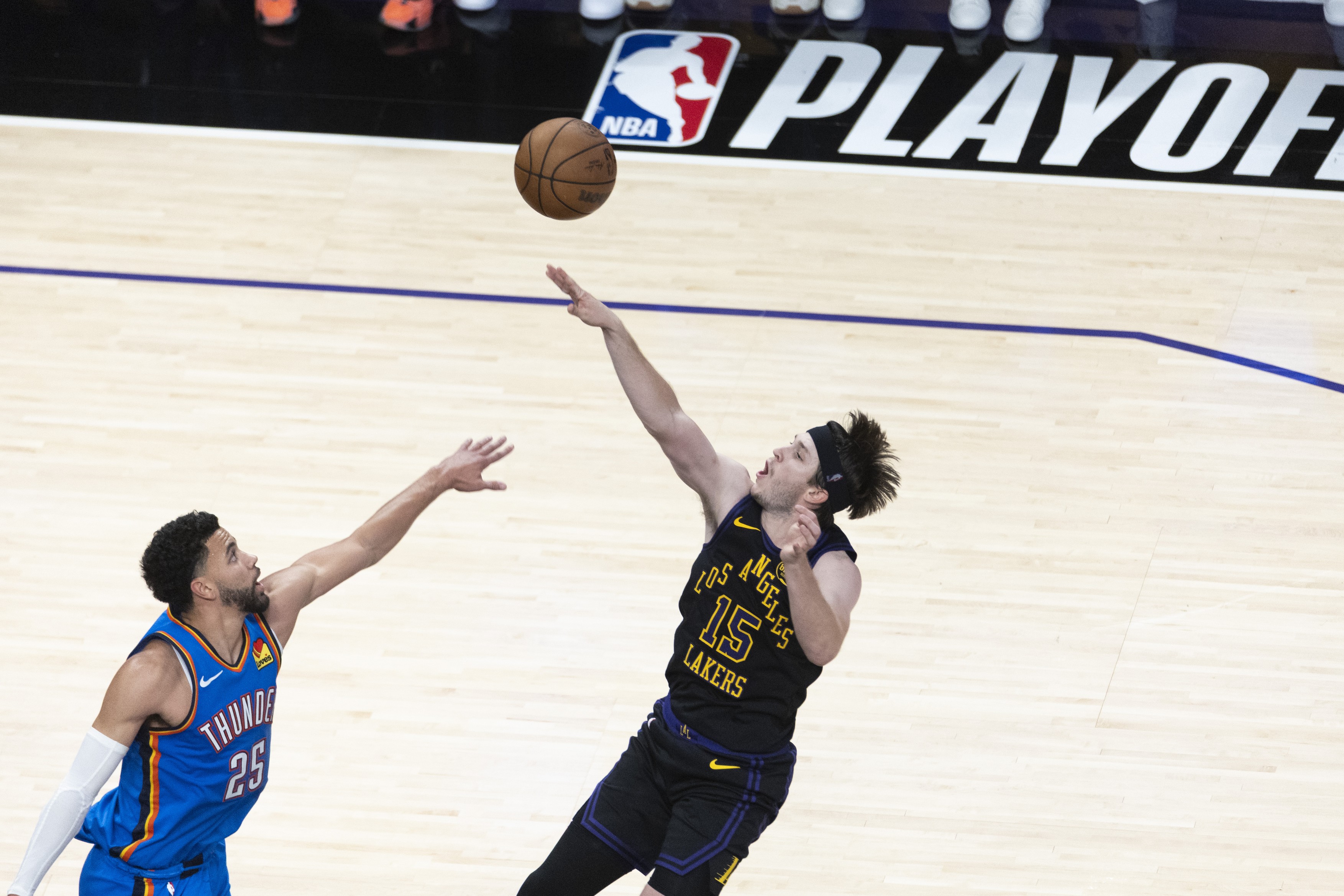 Los Angeles Lakers’ Austin Reaves (15) shoots against the Oklahoma City Thunder