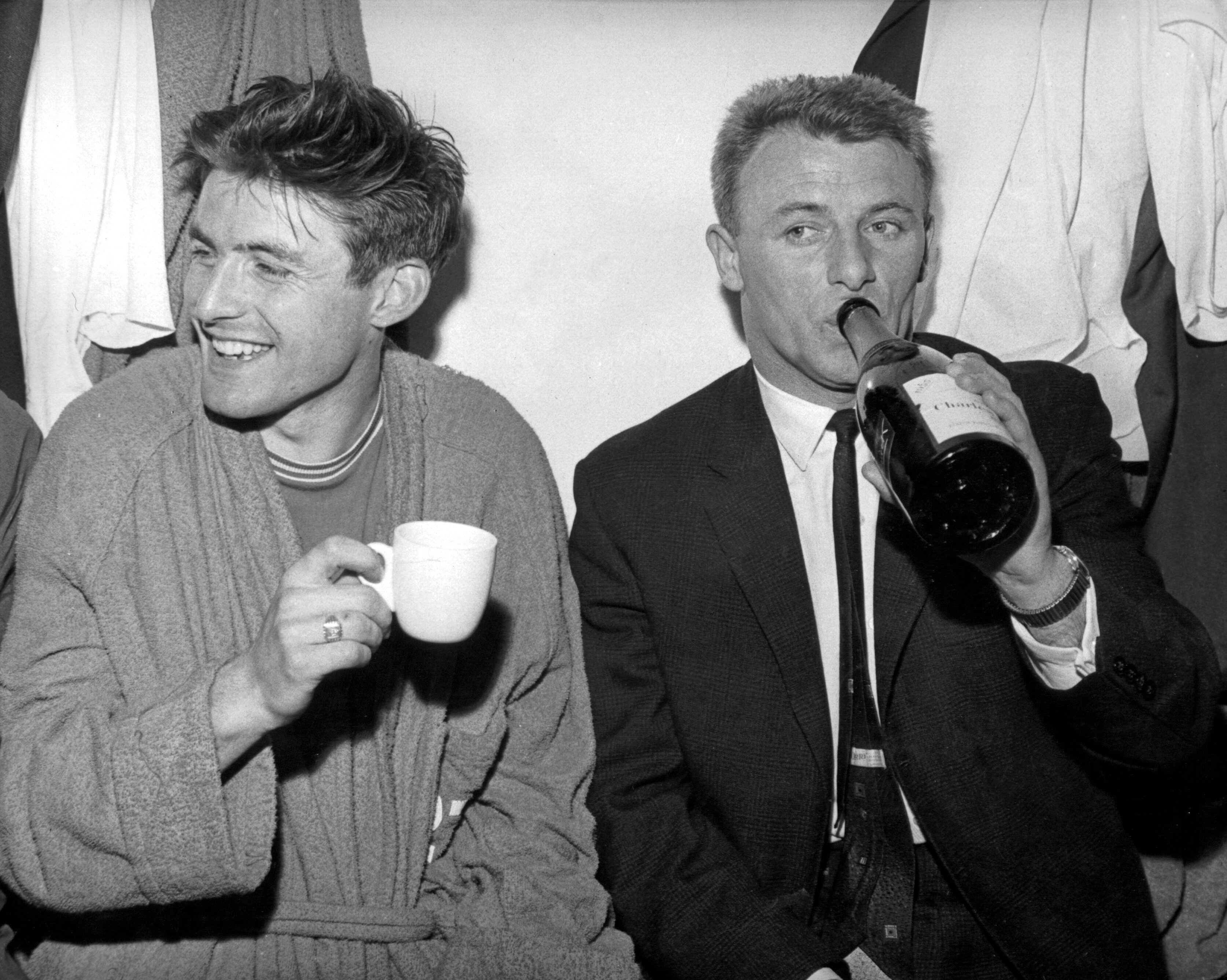 Bobby Tambling and Chelsea manager Tommy Docherty celebrate Chelsea's return to the first division following a 7-0 win over Portsmouth at Stamford Bridge.21st May 1963.