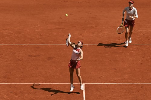 Serbia's Aleksandra Krunic (front) smashes the ball past Kazakhstan's Anna Danilina