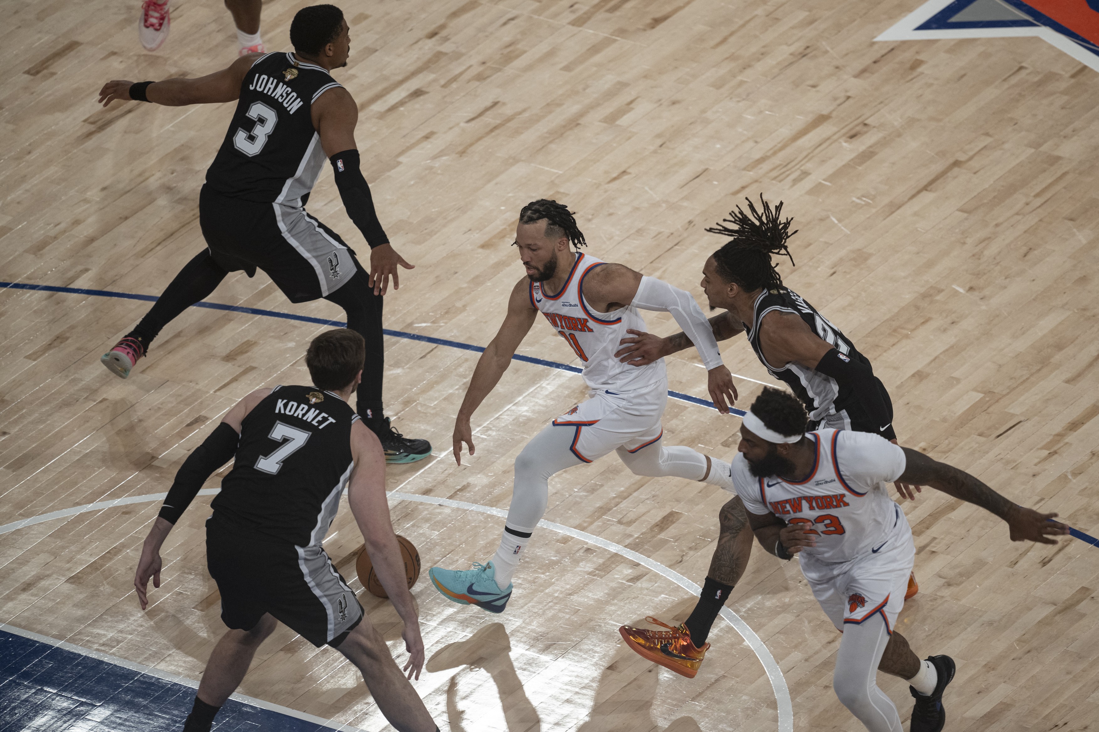 NEW YORK, UNITED STATES - JUNE 8: Jalen Brunson (11) of the New York Knicks and Luke Kornet (7) and Devin Vassell (24) of San Antonio Spurs in action