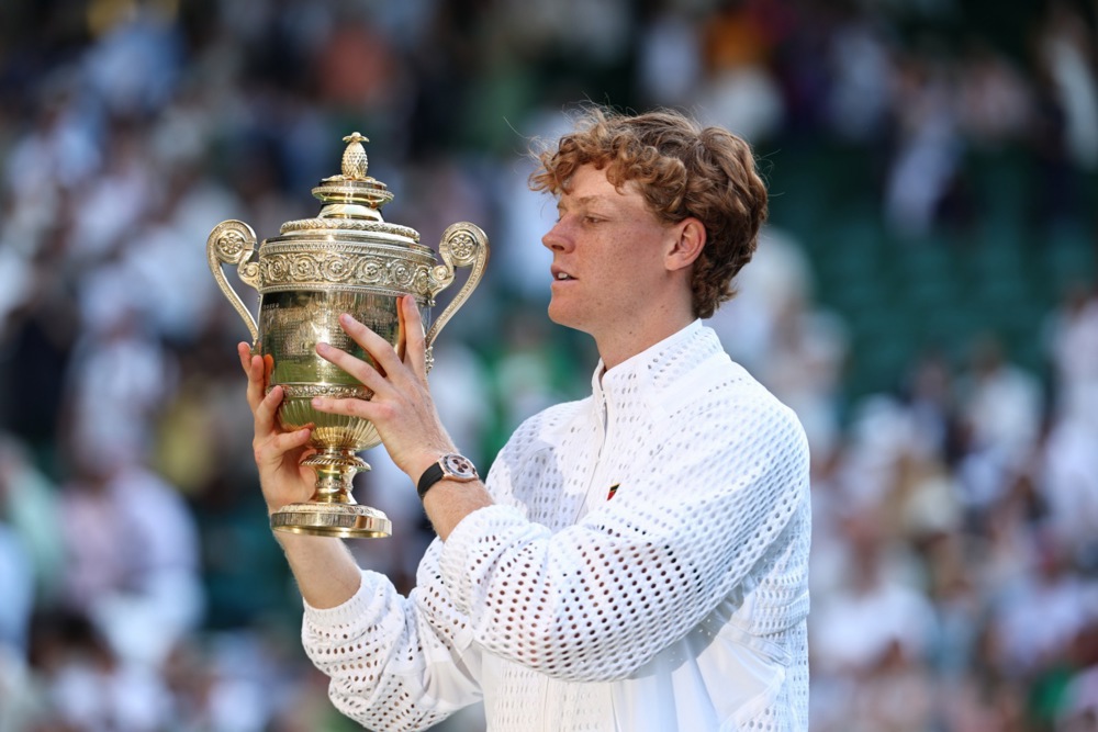 epaselect epa13107558 Jannik Sinner of Italy celebrates with the trophy after winning the Men's Singles final against Alexander Zverev of Germany at the Wimbledon Championships in London, Britain, 12 July 2026.  EPA/NEIL HALL