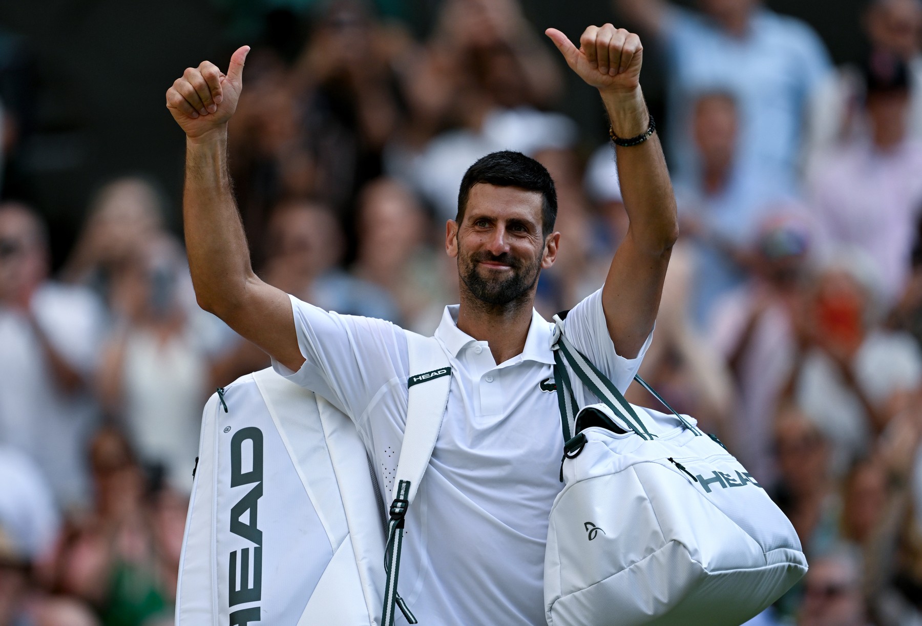 LONDON, July 11, 2026  -- Novak Djokovic greets the spectators after the men's