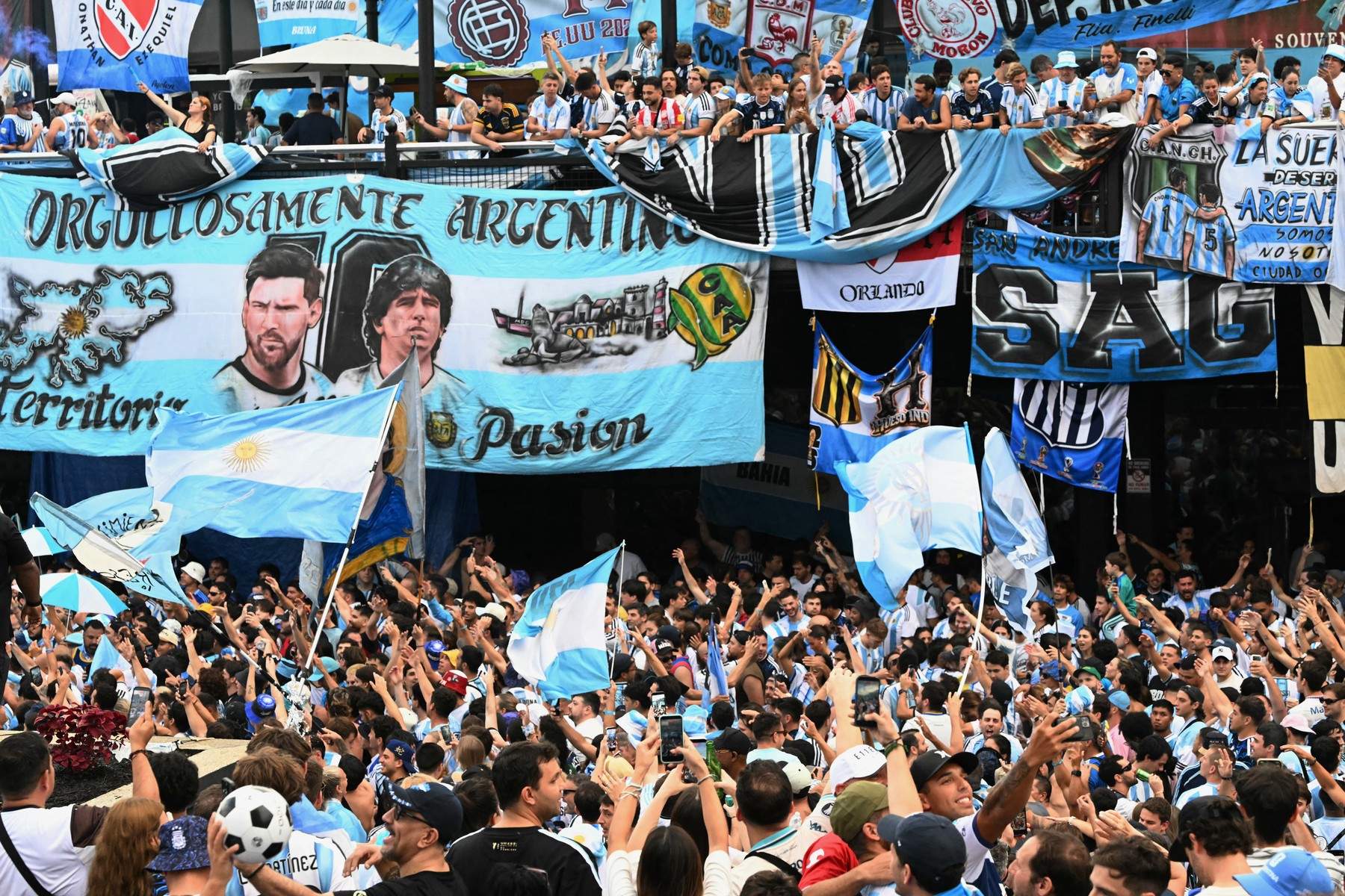 Argentine fans cheer during a flag-waving gathering on the eve of the 20