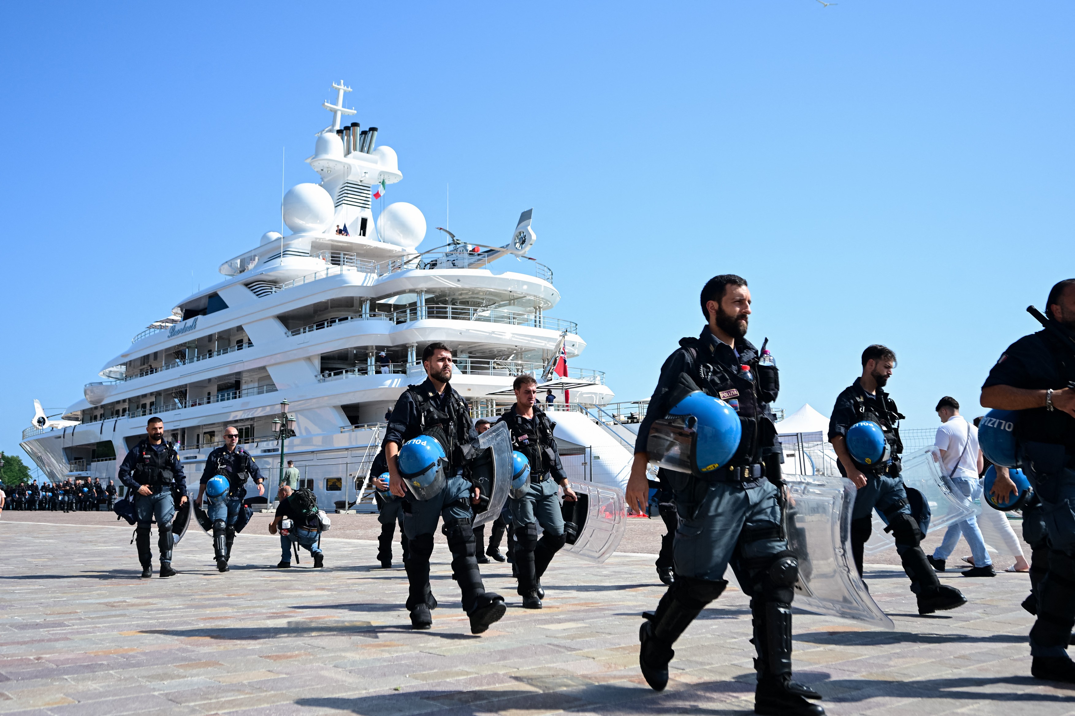 VENICE, ITALY - JULY 17: Police officers walk in front of US Ambassador to Italy Tilma