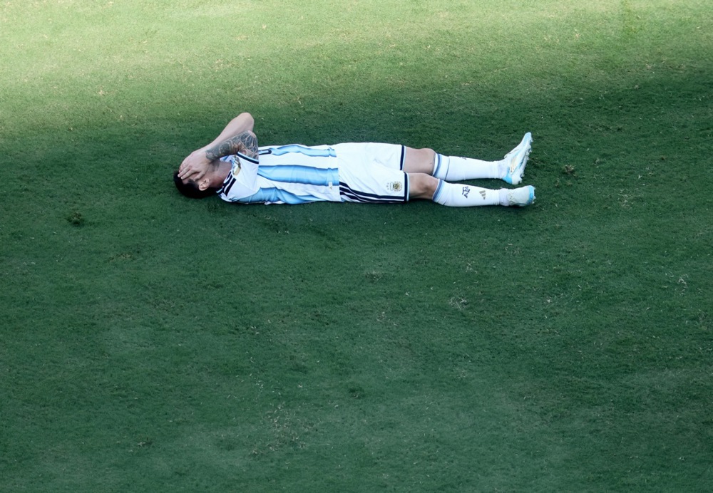epa13121404 Lionel Messi of Argentina lies on the pitch following a tackle during the FIFA World Cup 2026 final match Spain against Argentina, in New Jersey, USA, 19 July 2026.  EPA/RONALD WITTEK