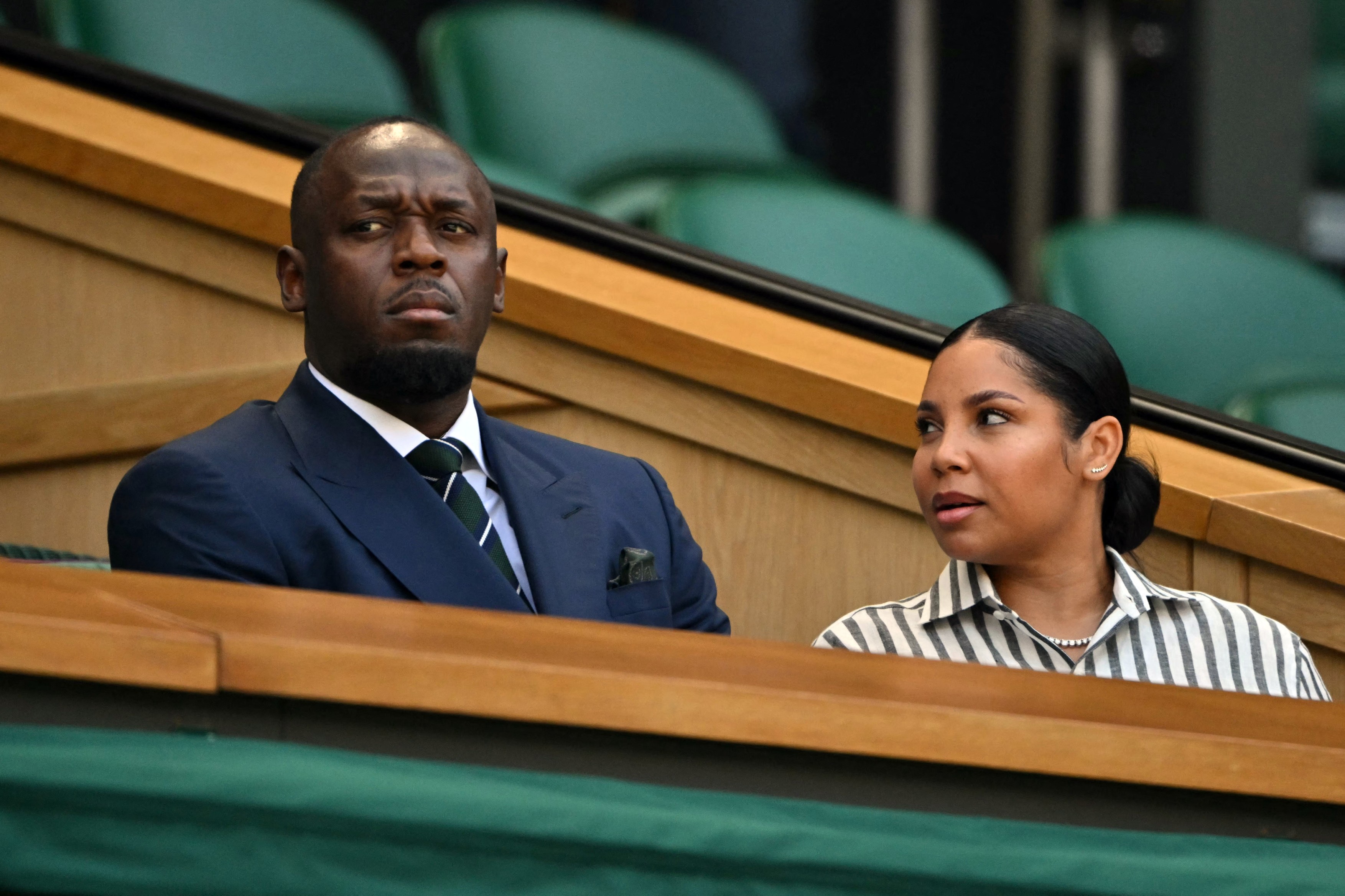 Jamaican retired sprinter Usain Bolt sits in the Centre Court's Royal Box
