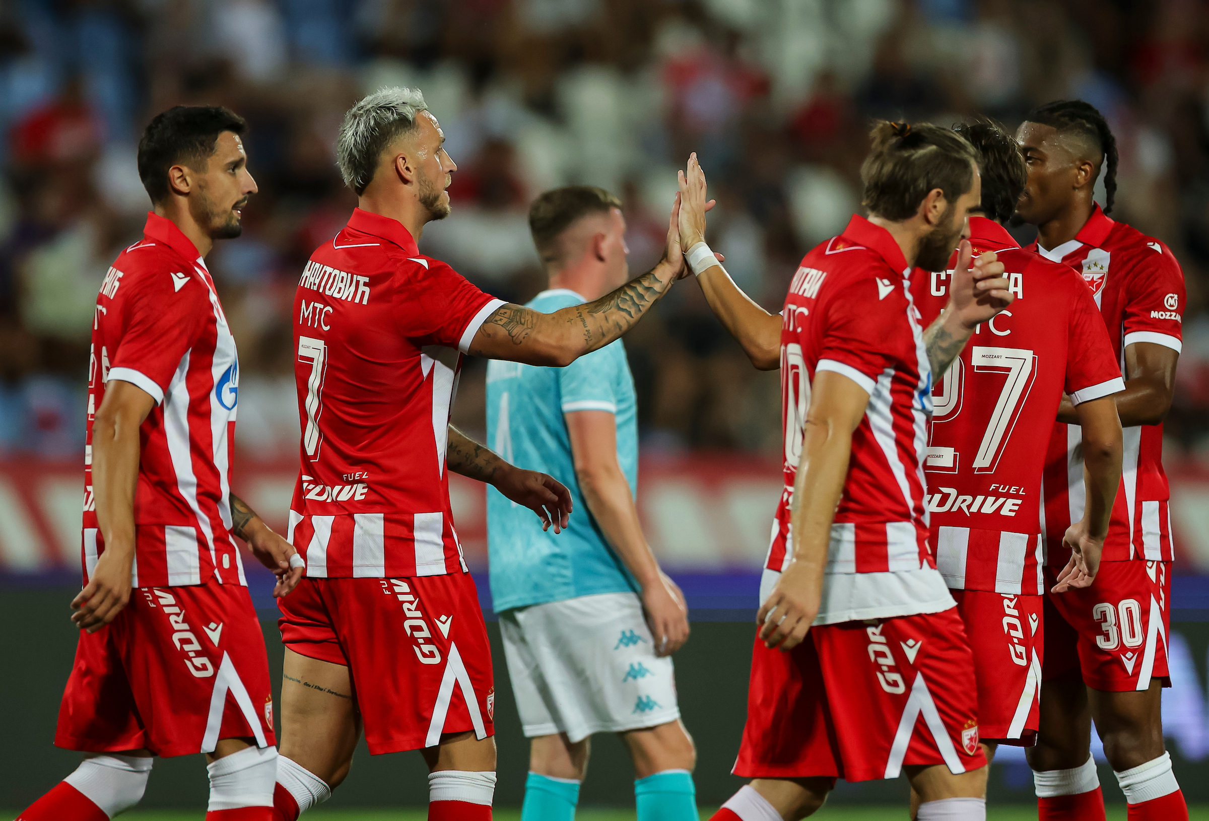 Marko Arnautovic (L) and Matej Strika of Crvena Zvezda celebrate
