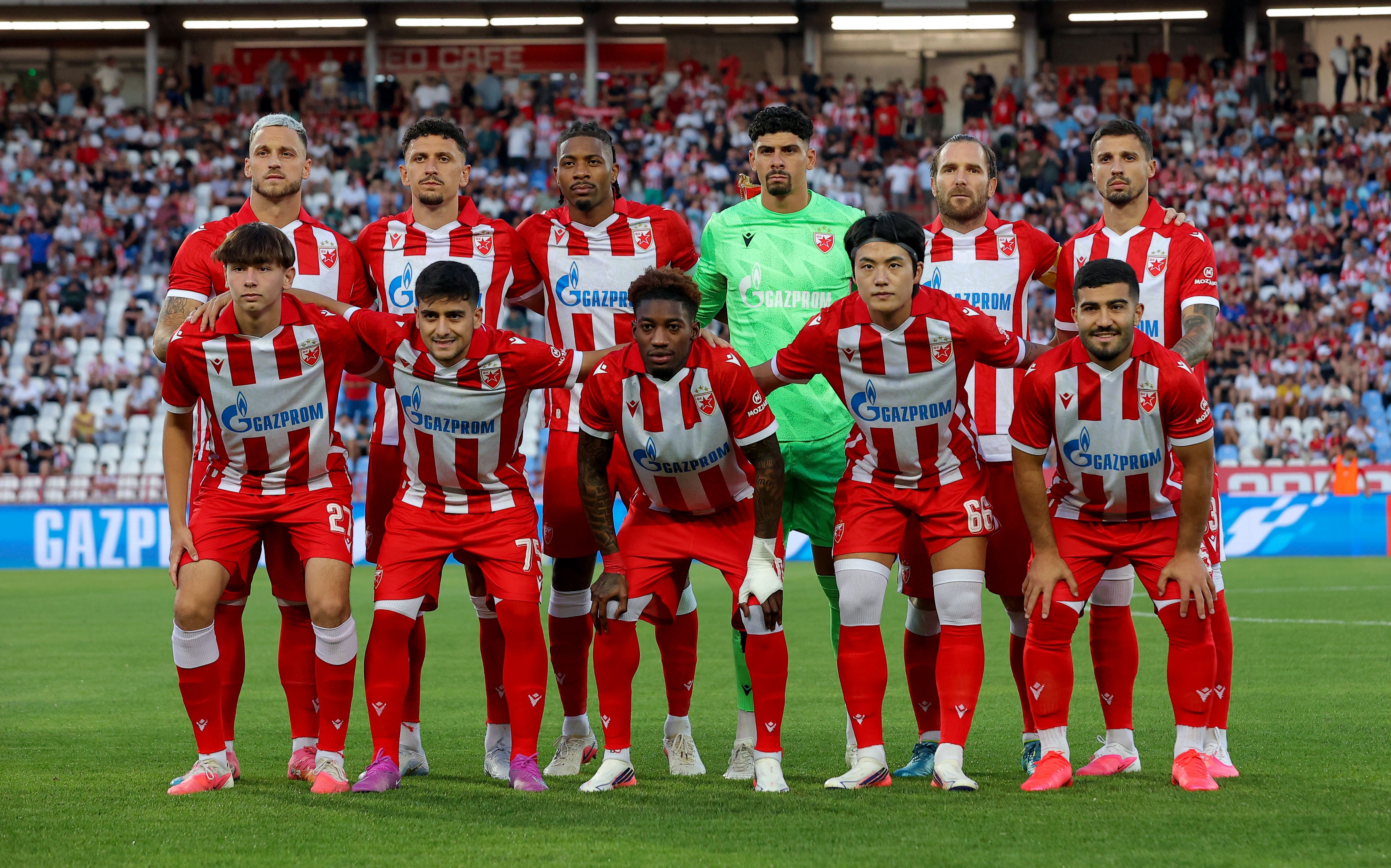 Players of Crvena Zvezda line up for starting 11 team photo during Crvena Zvezda v Larne FC football match of UEFA Champions League 2026/2027