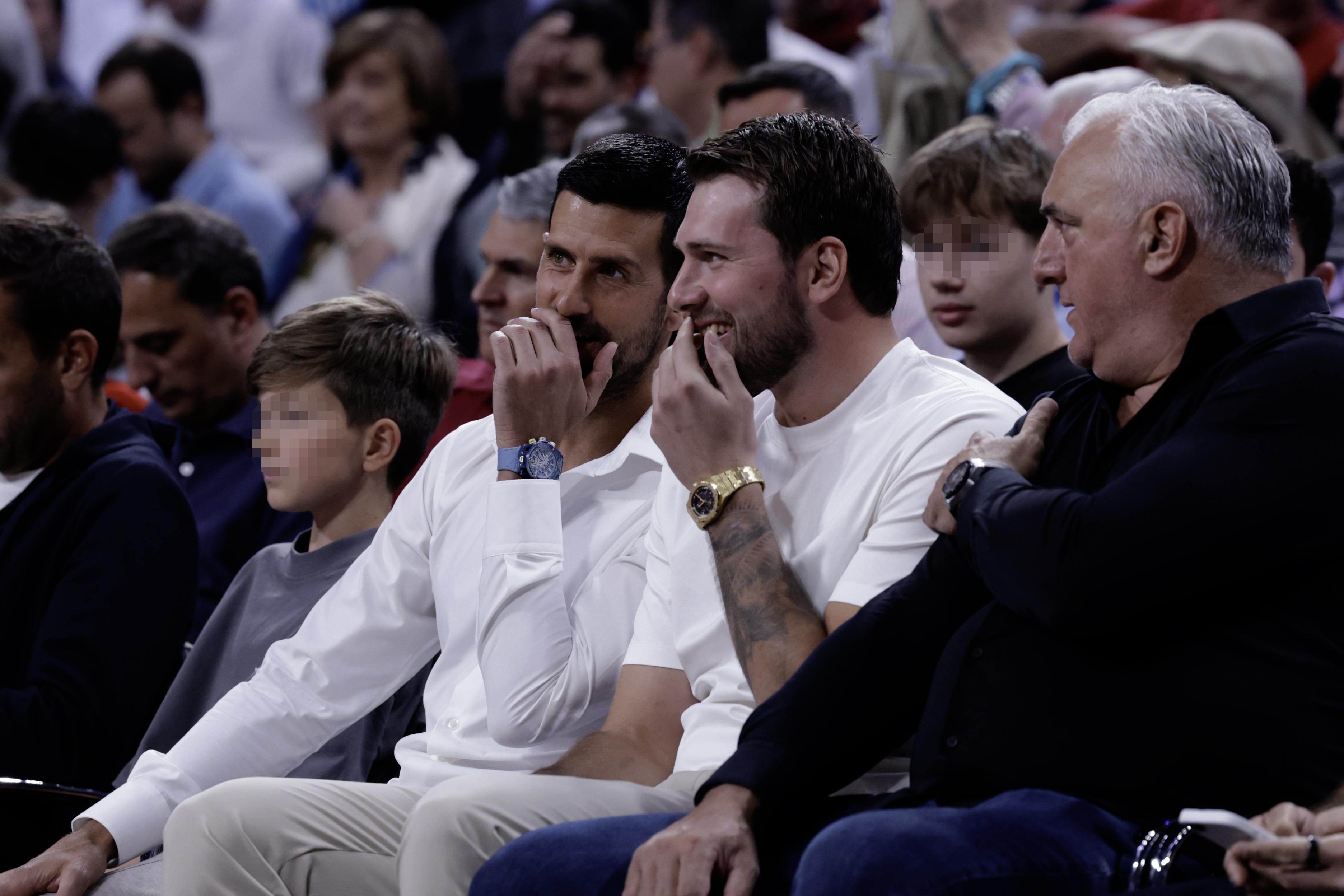 Slovenian basketball player Luka Doncic of the LA Lakers (2-R) and tennis player Novak Djokovic (C) of Serbia