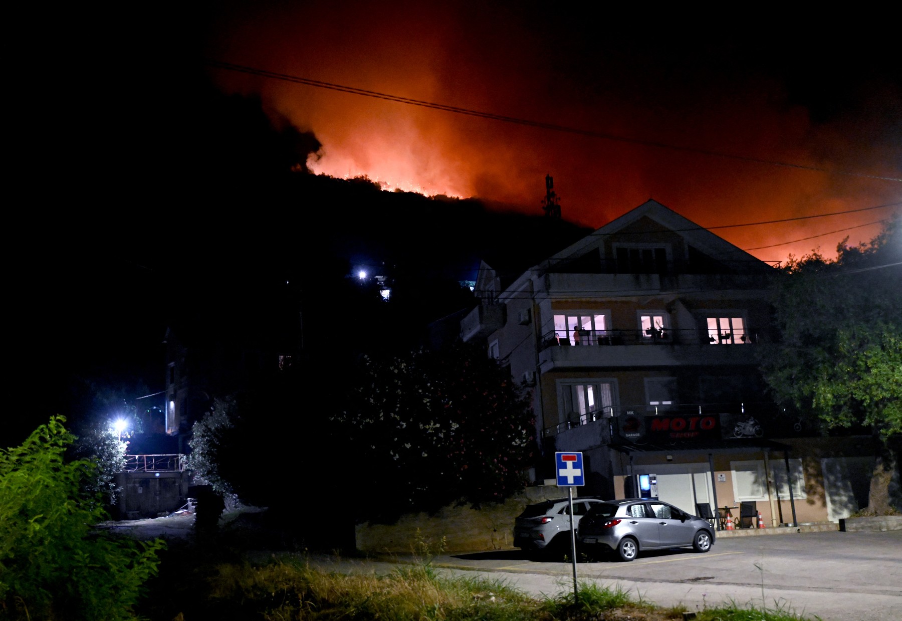 Smoke rises as a wildfire rages near residential buildings in the village of Bijela, Montenegro on August 12, 2026.,Image: 1122676161, License: Rights-managed, Restrictions: , Model Release: no  , Credit line: SAVO PRELEVIC / AFP / Profimedia