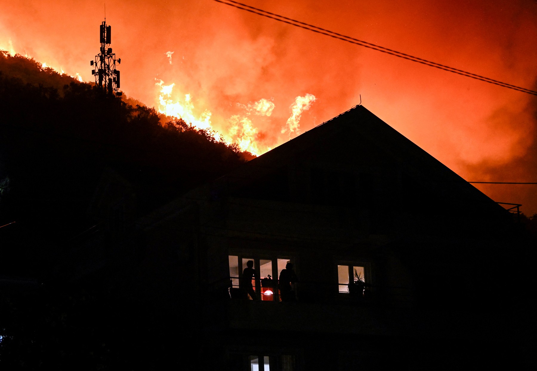 Smoke rises as a wildfire rages near residential buildings in the village of Bijela, Montenegro on August 12, 2026.,Image: 1122676158, License: Rights-managed, Restrictions: , Model Release: no  , Credit line: SAVO PRELEVIC / AFP / Profimedia