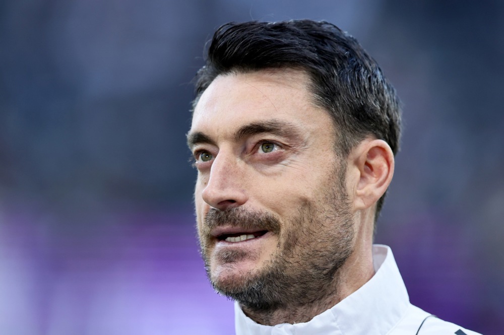 epa12787769 Head coach Albert Riera of Frankfurt reacts