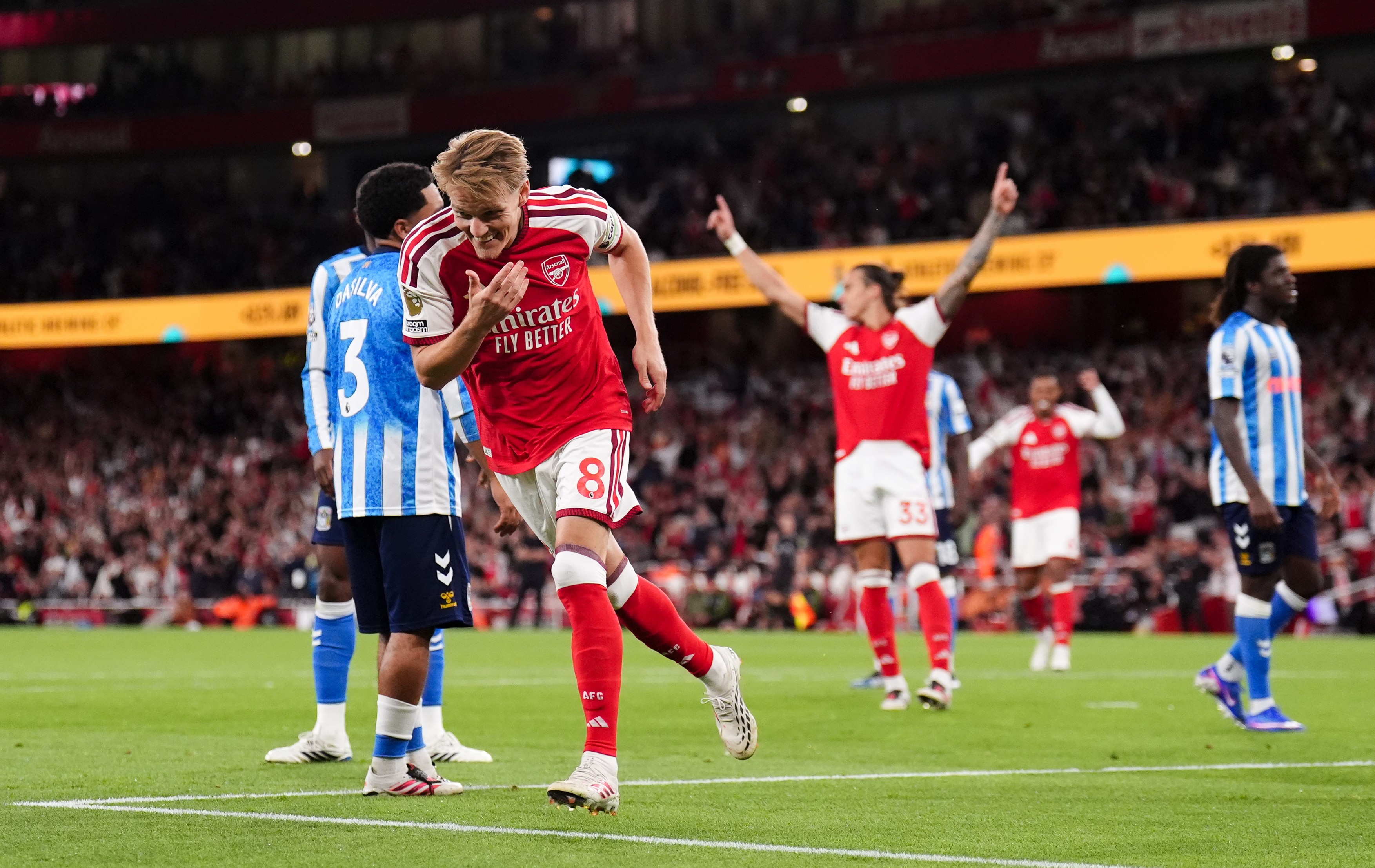 Arsenal's Martin Odegaard celebrates scoring his sides third goal during the Premier League match at the Emirates Stadium, London. Picture date: Friday August 21, 2026.