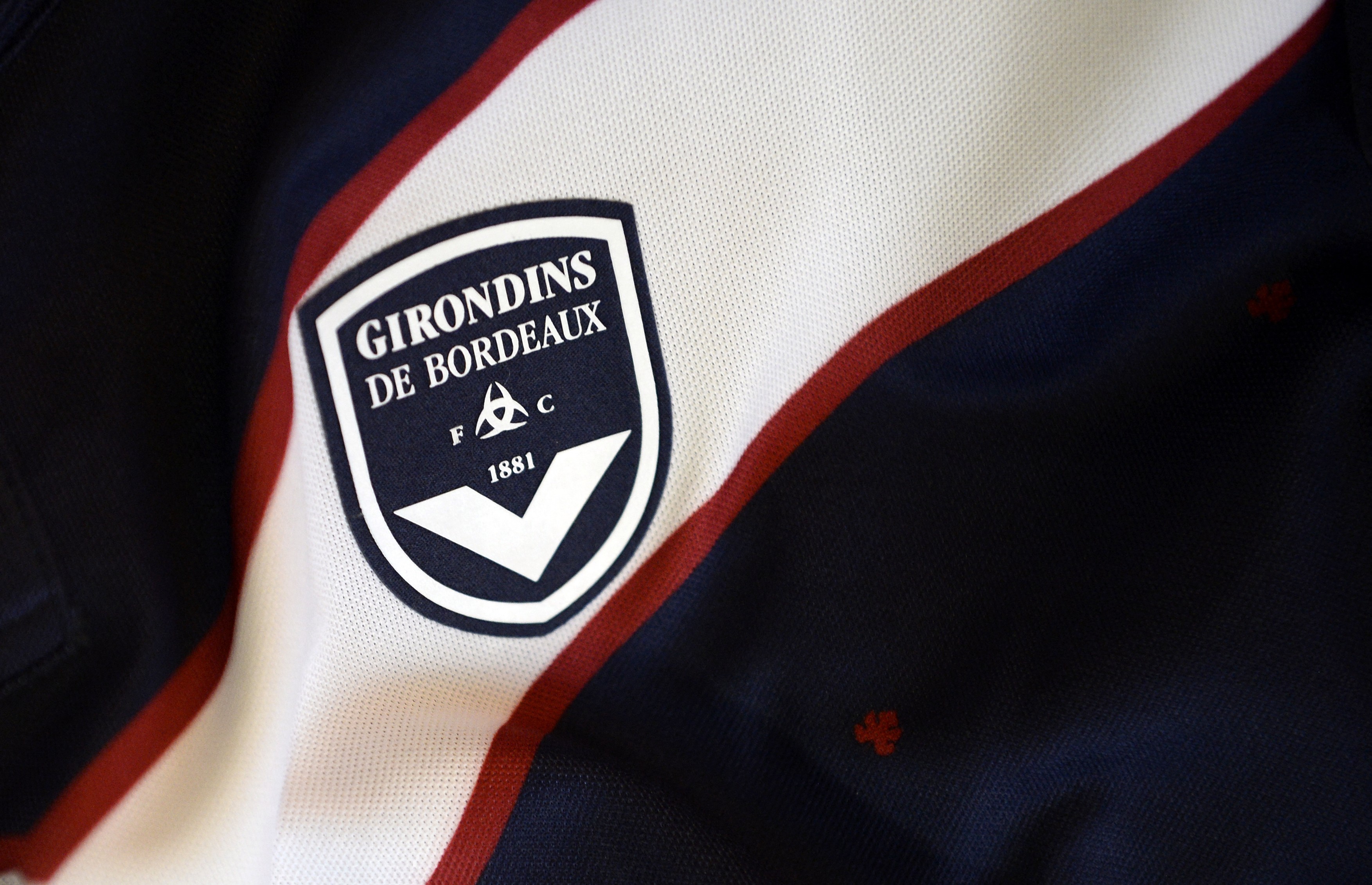 A photo taken on September 11, 2014 in Paris, shows a partial view of the new jersey of the Bordeaux (GBFC) football team.