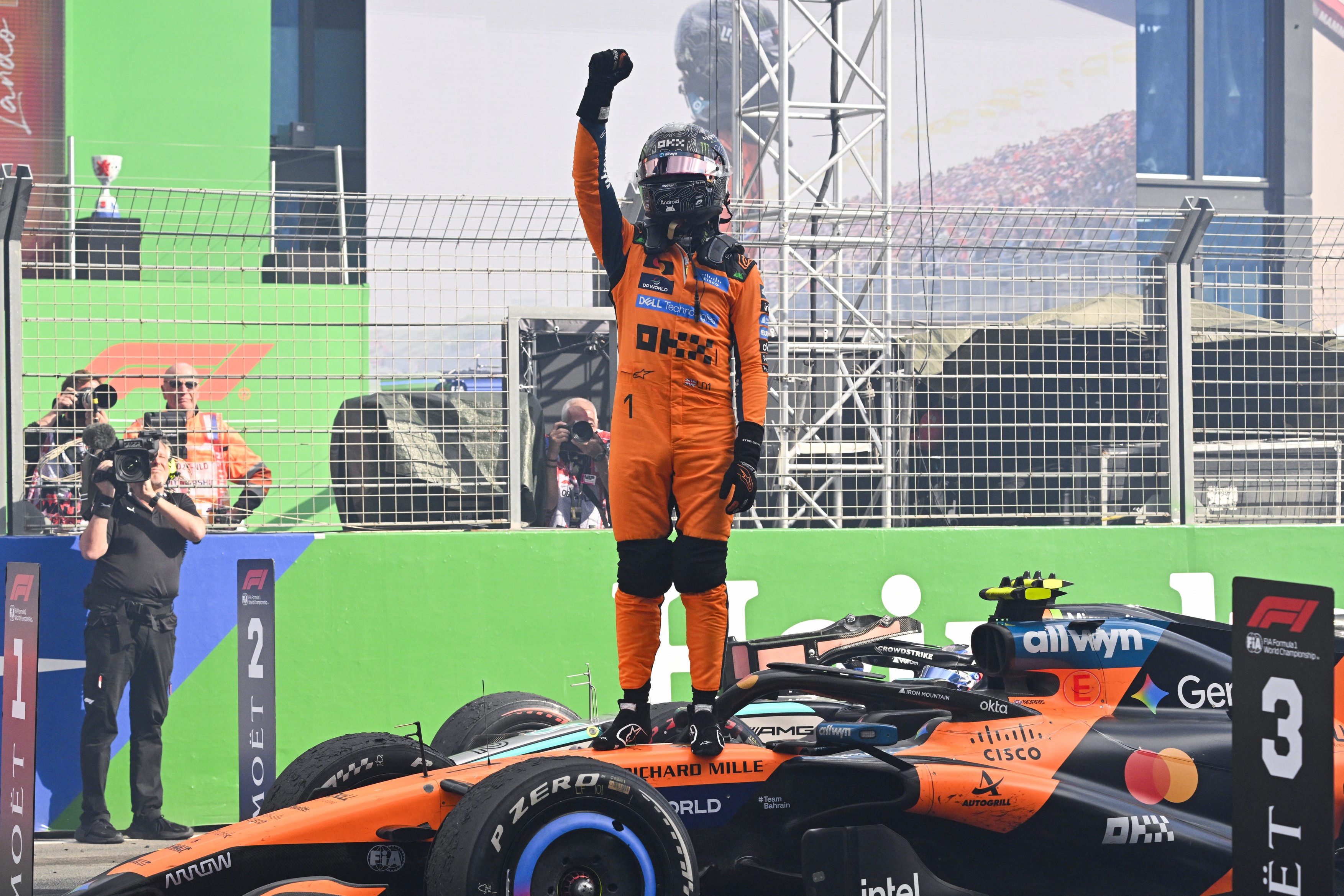 McLaren's British driver Lando Norris celebrates after winning the Formula One Dutch Grand Prix at The Circuit Zandvoort