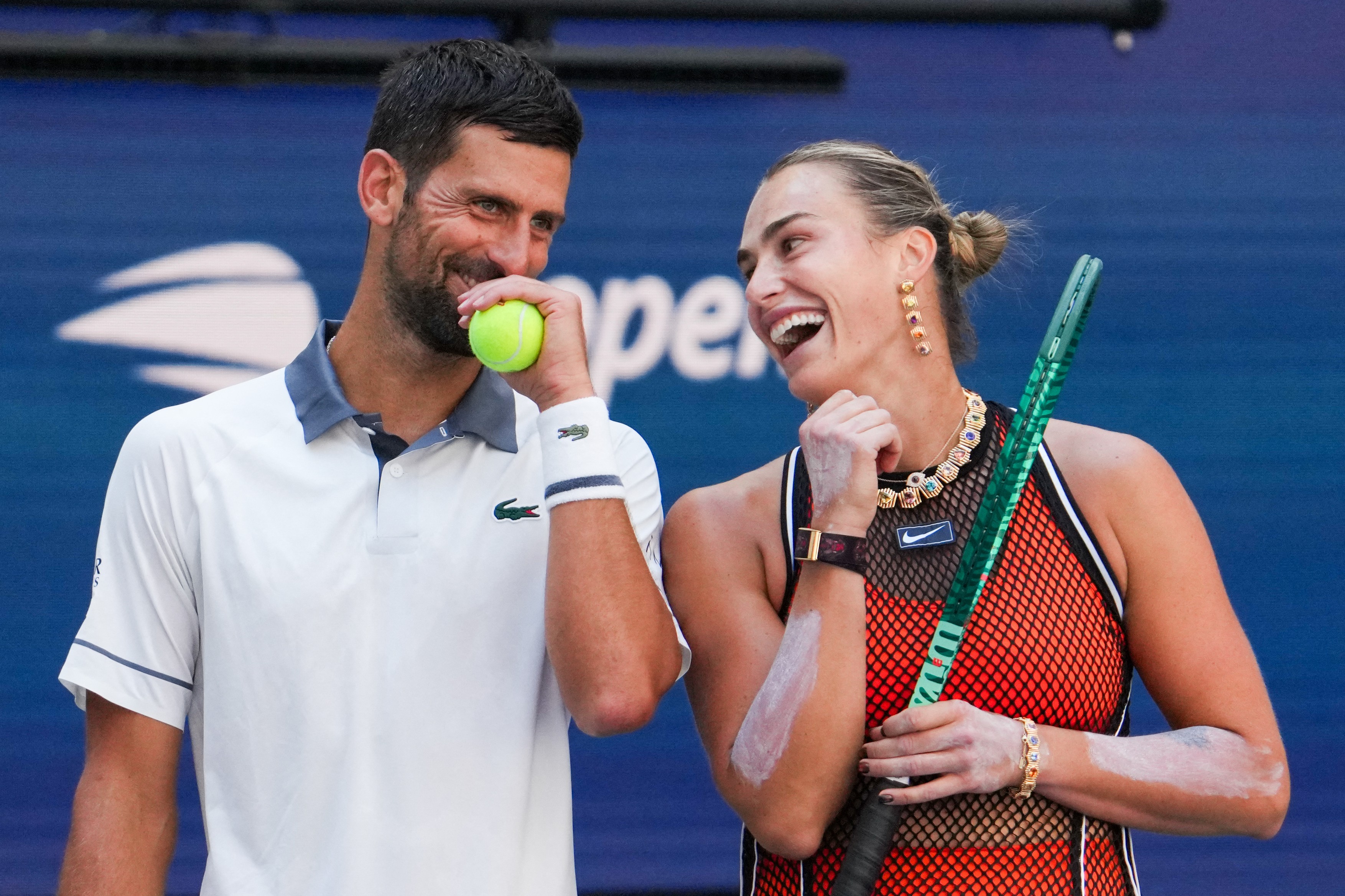 Serbia's Novak Djokovic and Belarus's Aryna Sabalenka speak with each other