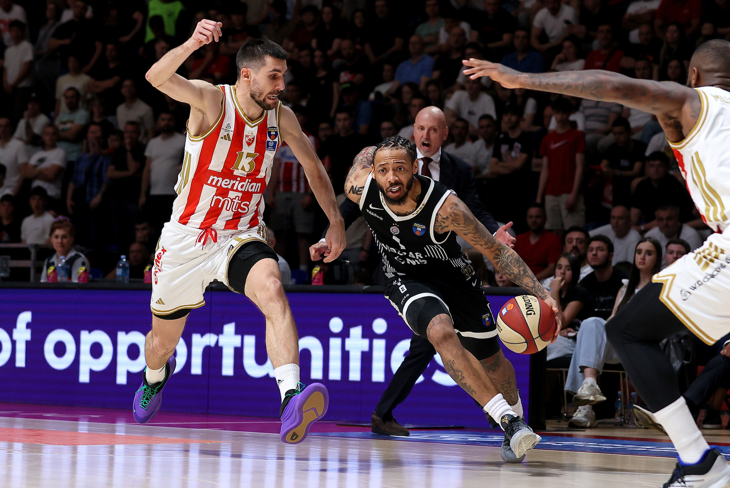 Ognjen Dobric of Crvena Zvezda (L) in action against Carlik Jones of Partizan (R) d