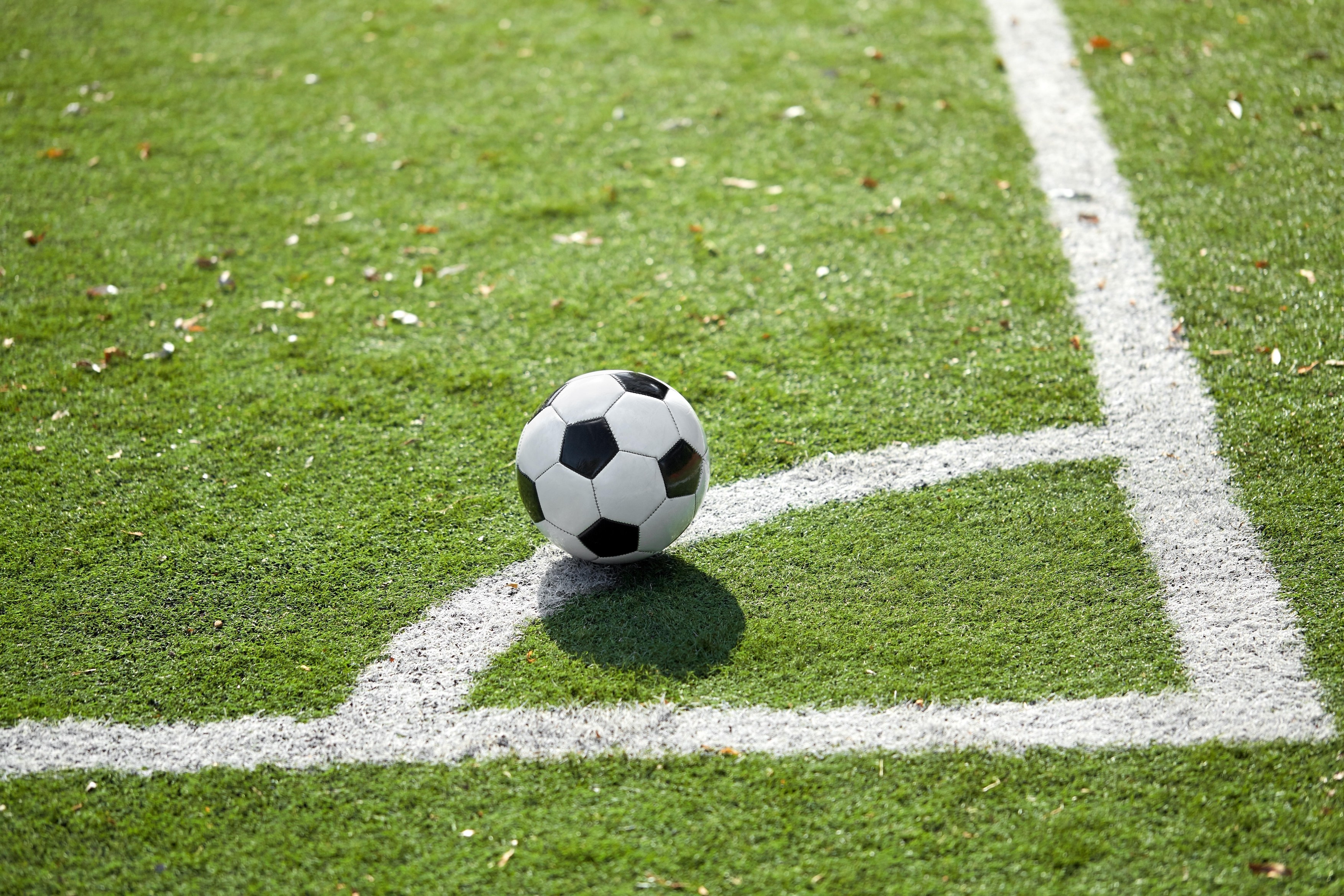 sport, soccer and game - ball on football field