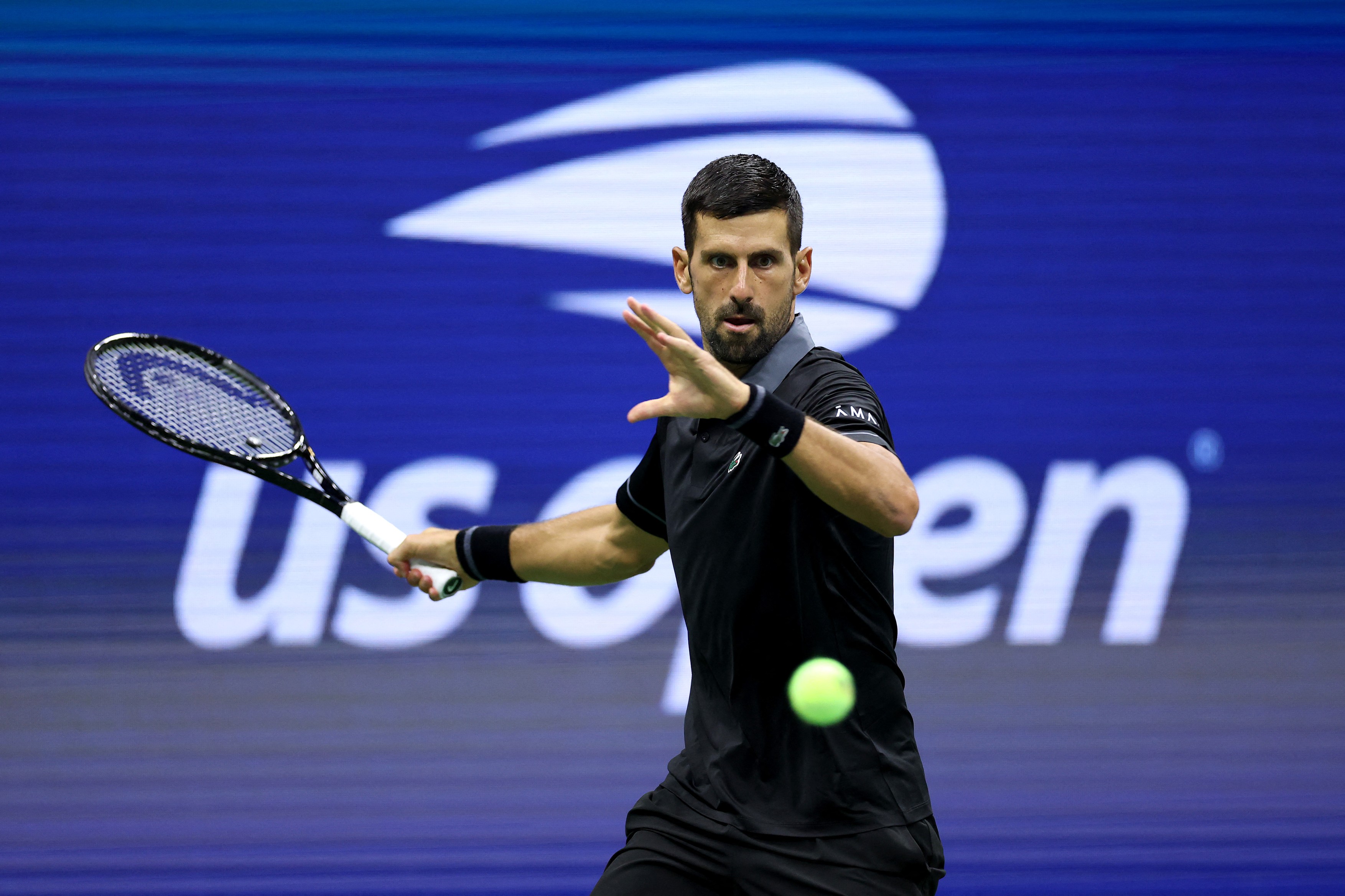Novak Djokovic of Serbia returns a shot in his match against Mariano Navone of Argentina