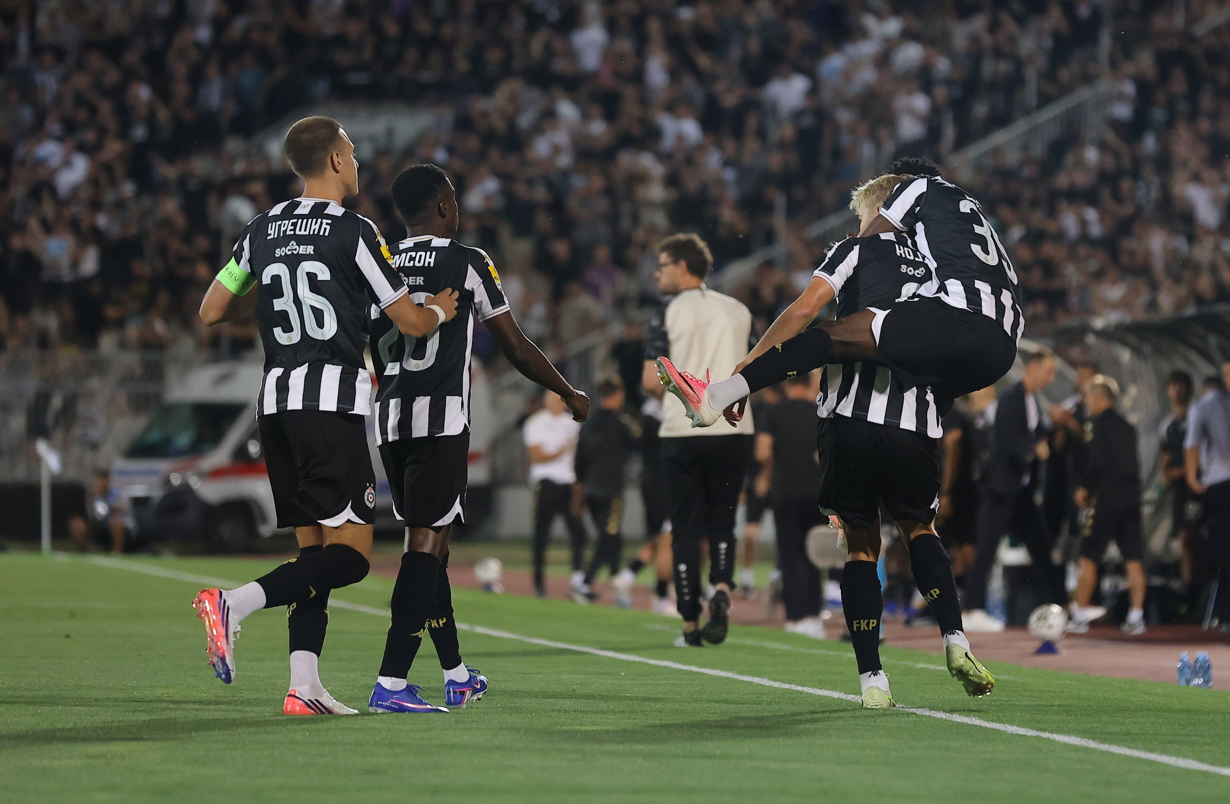 Players of Partizan celebrate with Erik Kojzek of Partizan after scoring a goa
