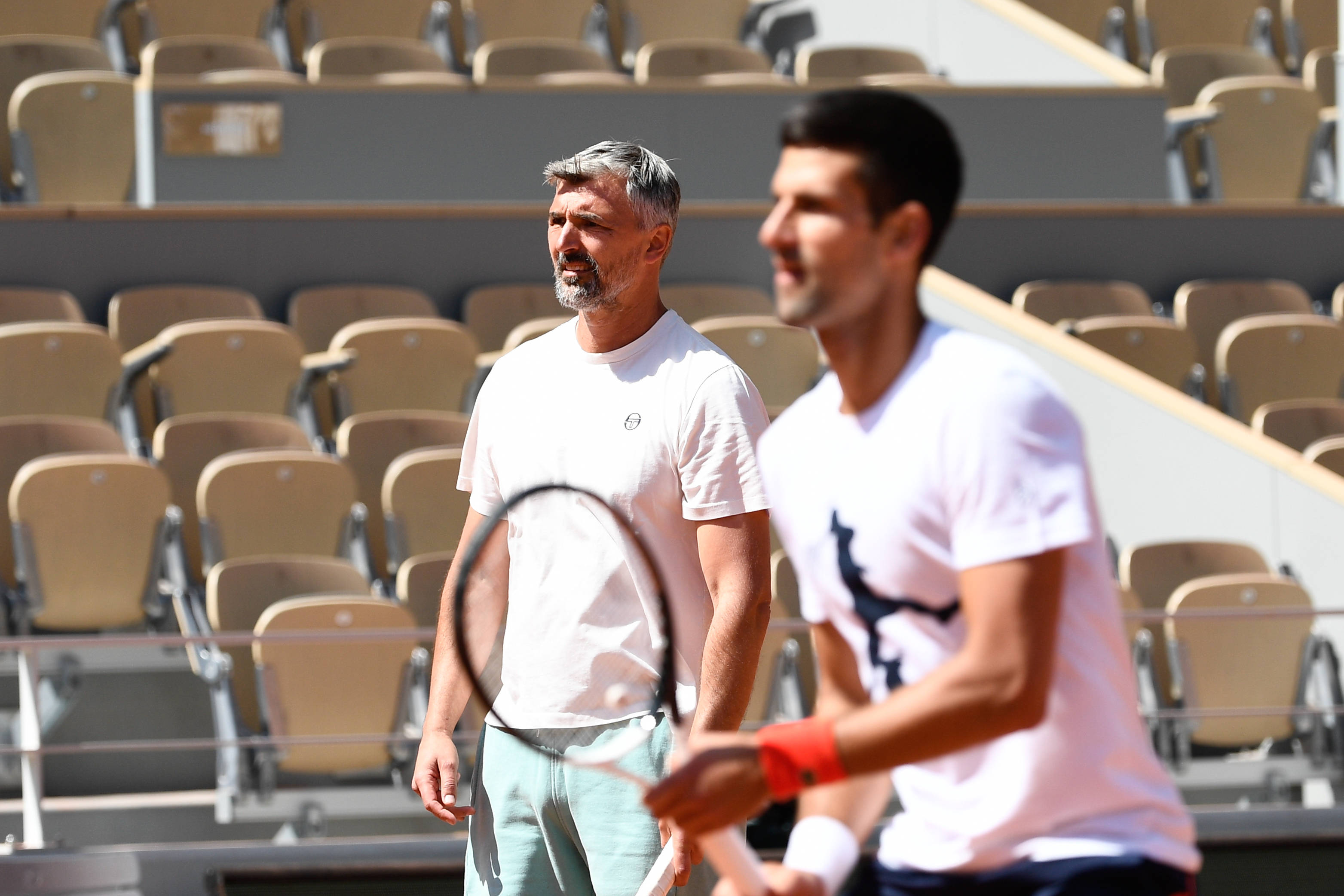 Novak Djokovic and Goran Ivanisevic during a training session on Philippe Chatrier