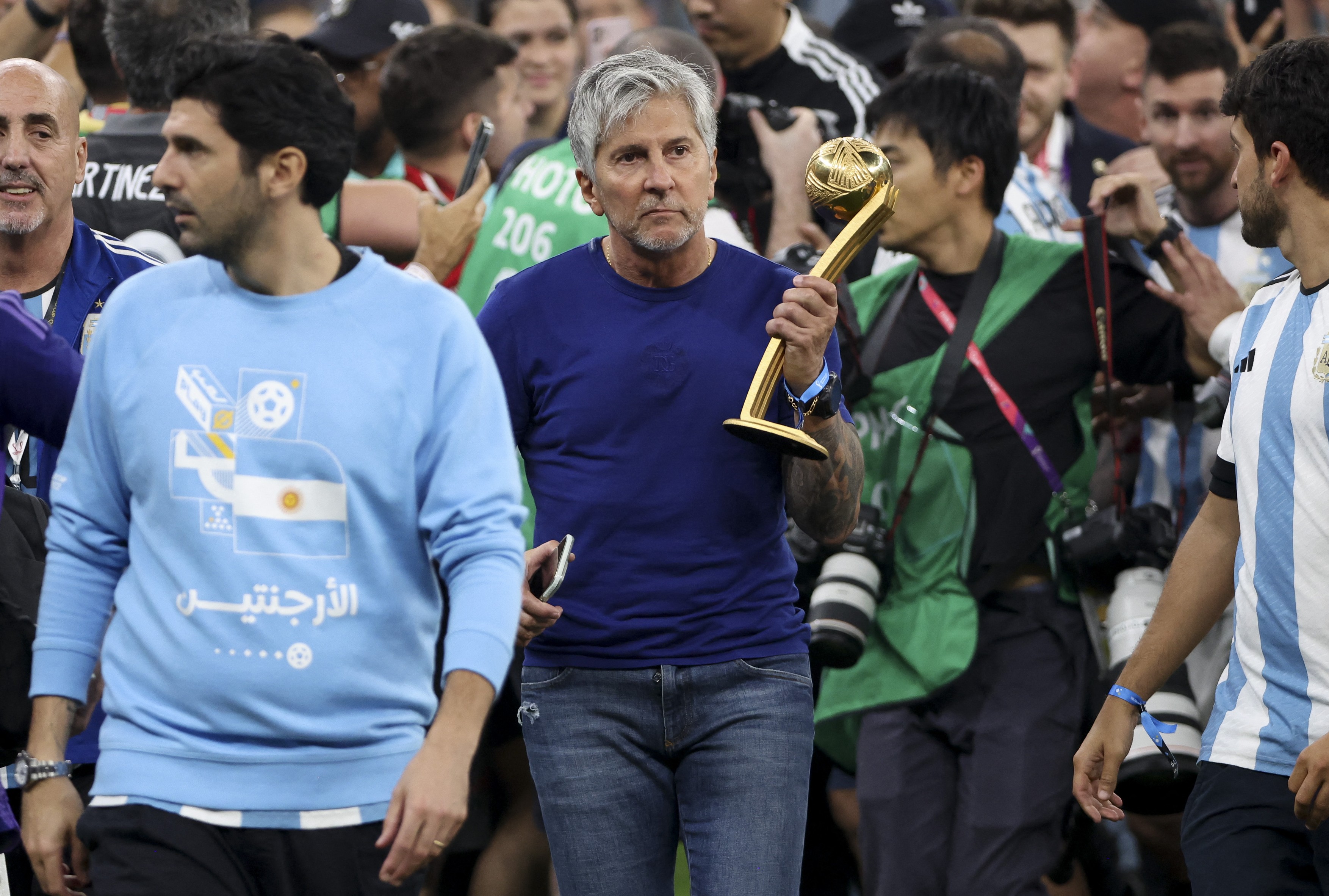 Jorge Messi, father and agent of Lionel Messi - holding his son's trophy of 'Best player of the World Cup'