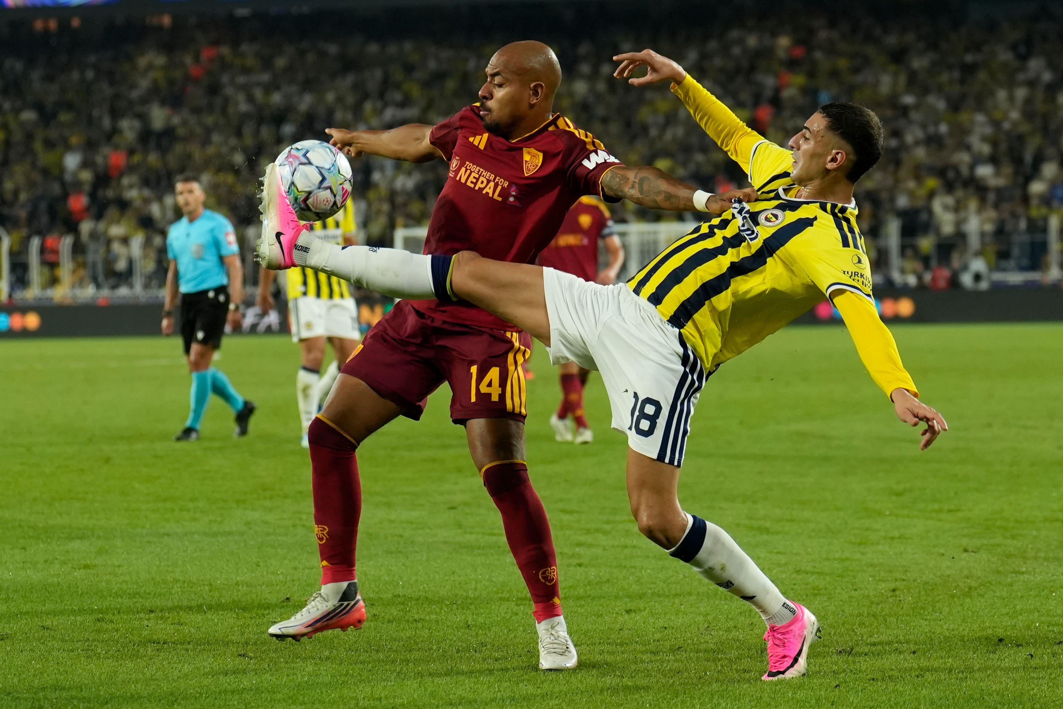 Donyell Malen (C-L) of AS Roma in action against Mert Muldur (C-R) of Fenerbahce