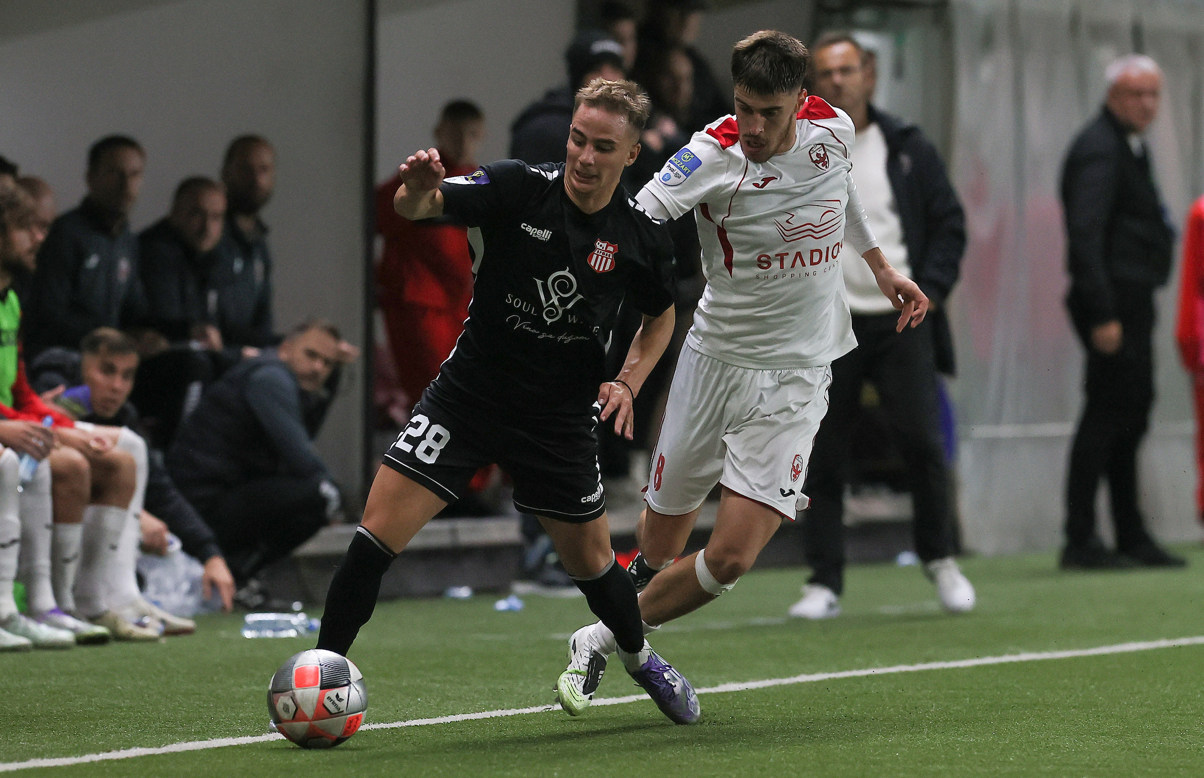 Novak Gojkov of Vrsac (L) in action against Vukasin Braunovic of Vozdovac (R)