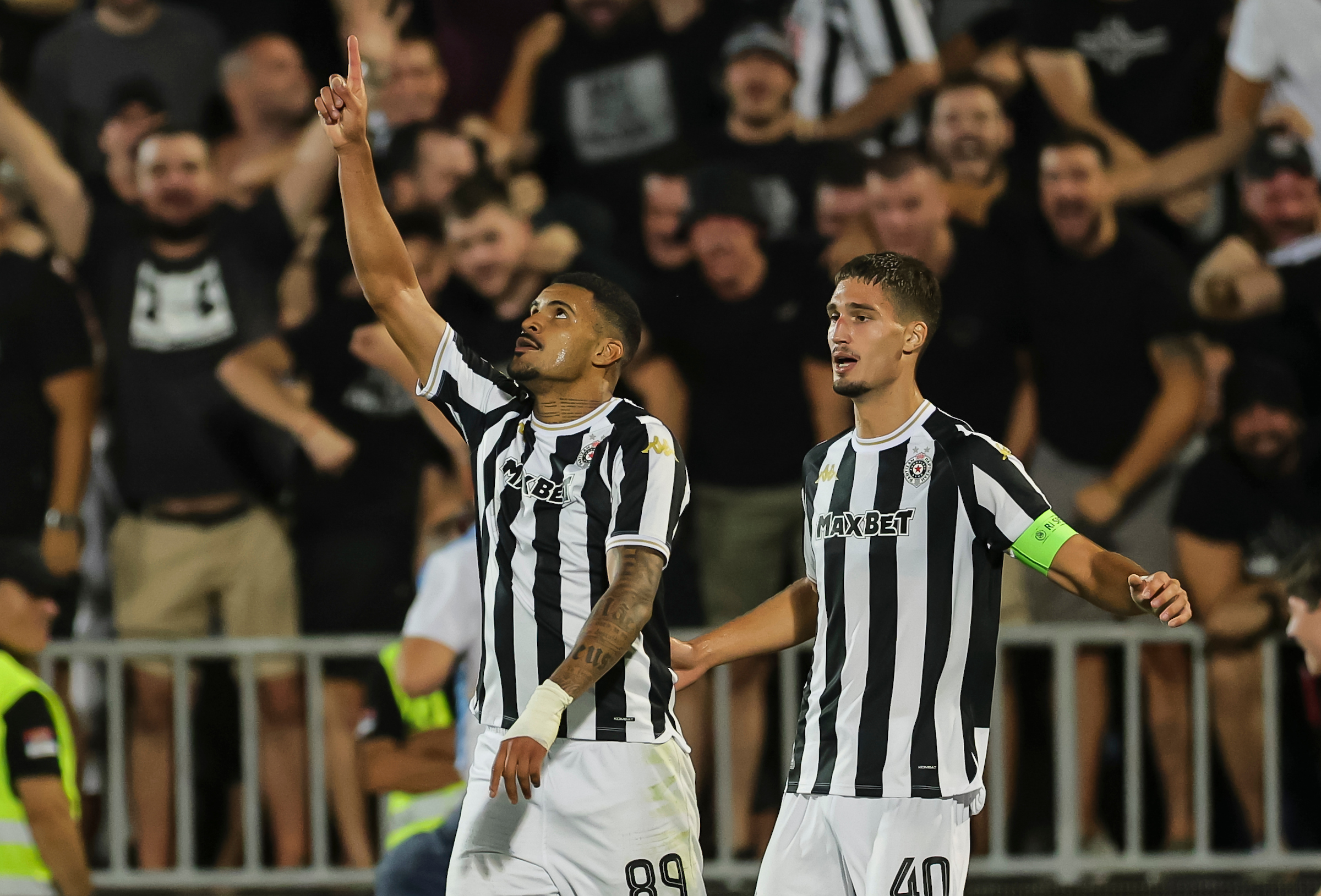 Jeferson Marinho dos Santos Jeh (L) of Partizan celebrates after scoring a goal with Nikola Simic