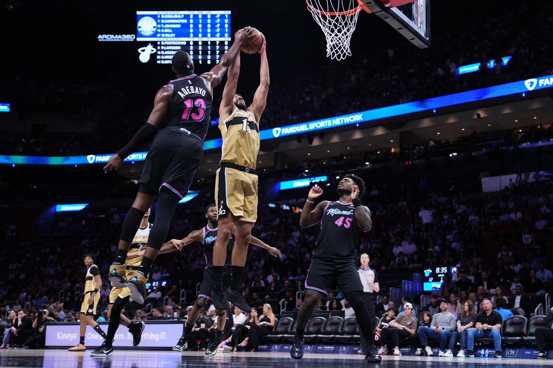 MIAMI, FLORIDA - APRIL 04: Bam Adebayo #13 of the Miami Heat blo