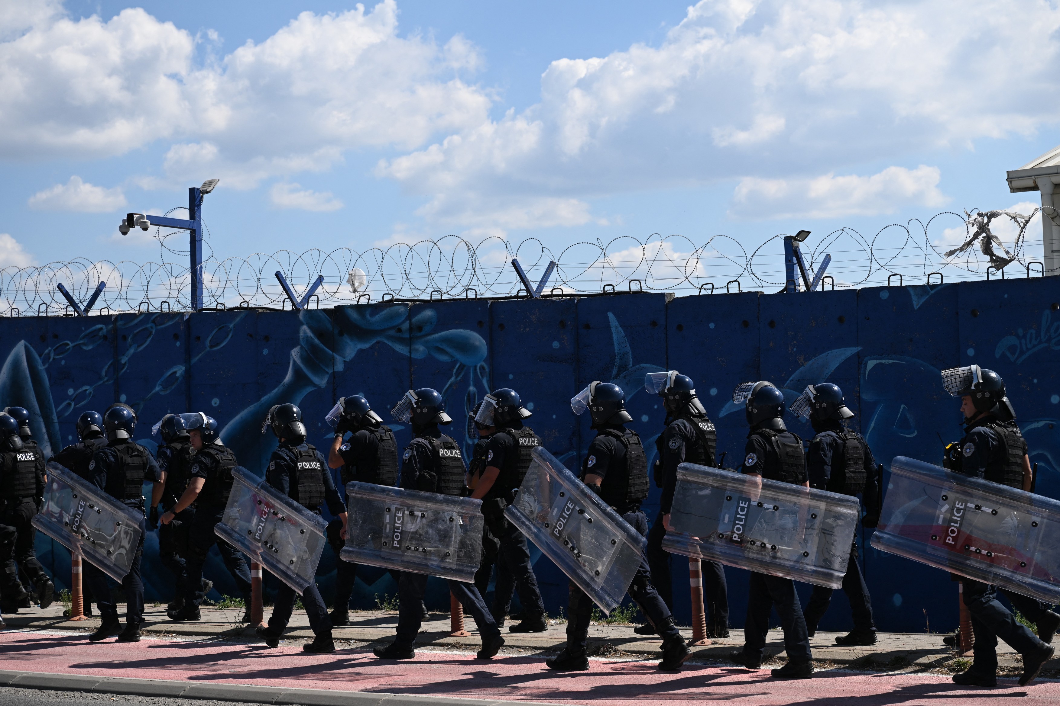 Kosovo riot police secure the EULEX headquarters in