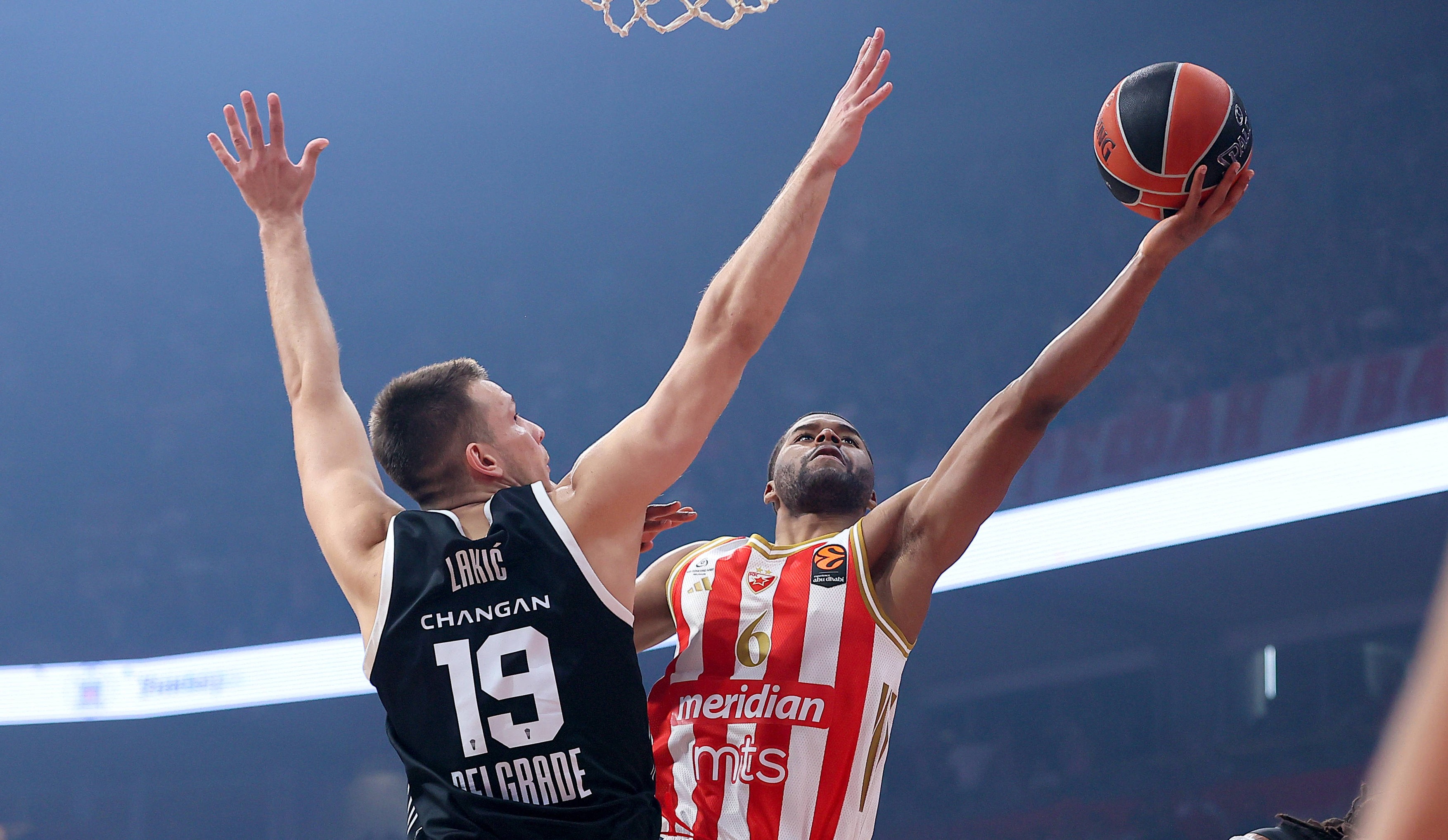 Arijan Lakic of Partizan (L) in action against Jared Butler of Crvena Zvezda (R)