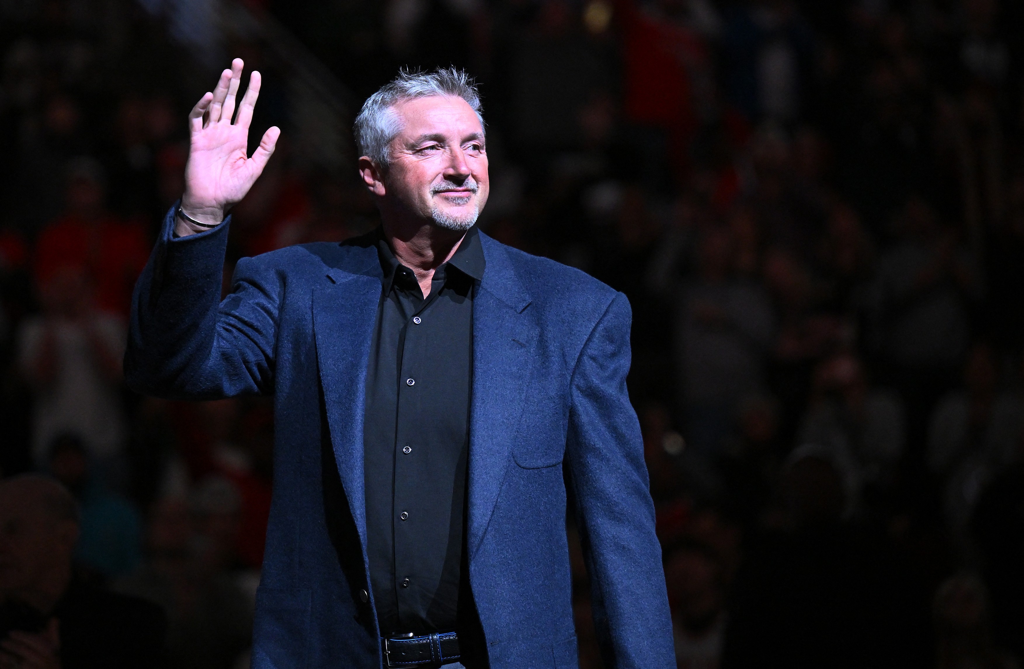 Former Chicago Bulls player Toni Kukoc waves to the crowd